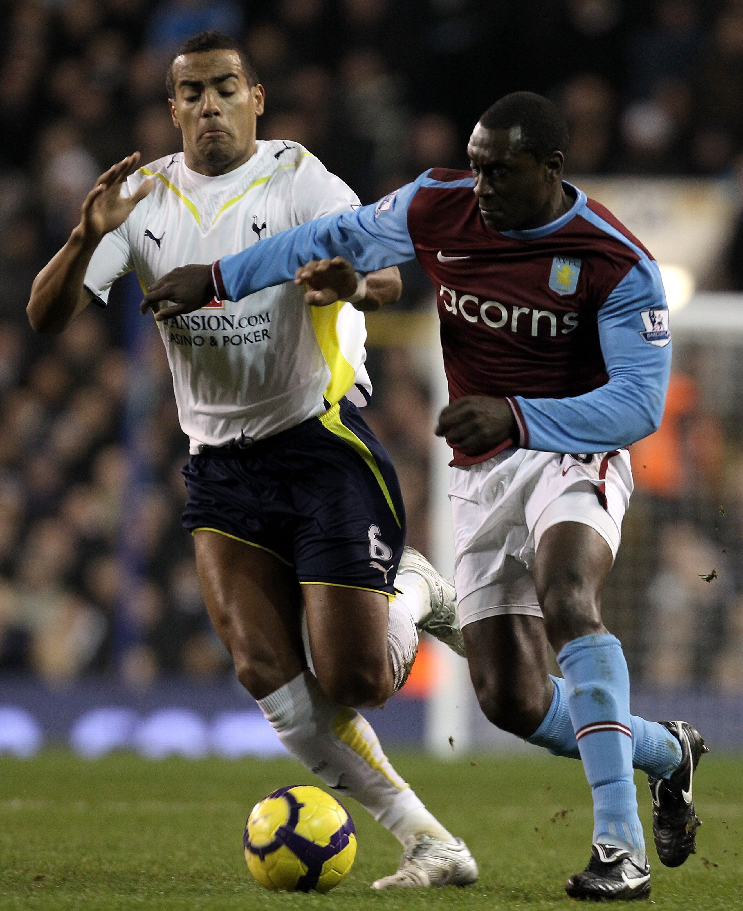 LONDON, ENGLAND - FEBRUARY 06:  Tom Huddlestone of Tottenham Hotspur and Emile Heskey of Aston Villa battle for the ball during the Barclays Premier League match between Tottenham Hotspur and Aston Villa at White Hart Lane on February 6, 2010 in London, E