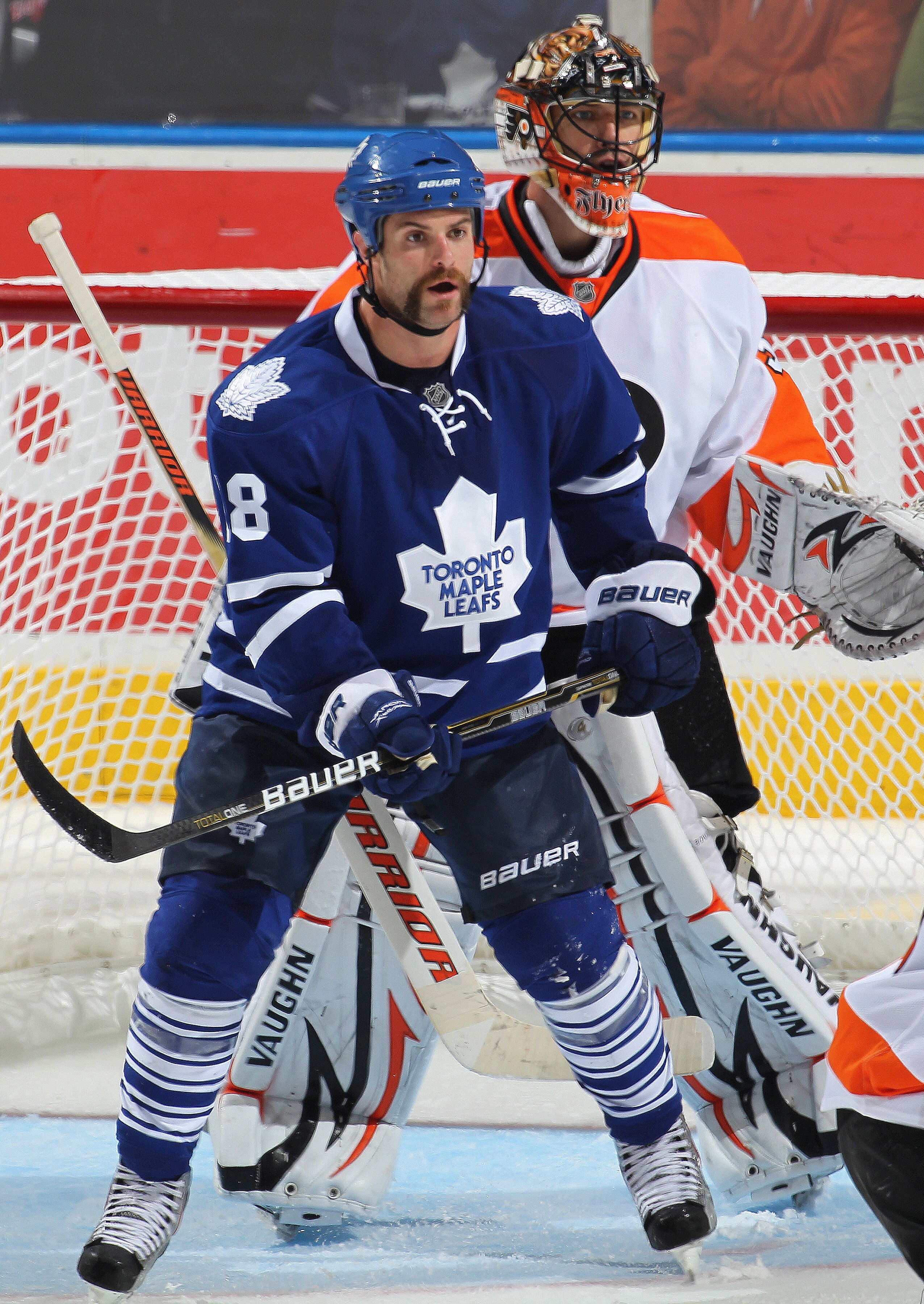LONDON, CANADA - SEPTEMBER 23: Mike Brown #18 of the Toronto Maple Leafs settles in the crease in front of goalie Brian Boucher #33 of the Philadelphia Flyers in a preseason game on September 23,2010 at the John Labatt Centre in London, Ontario. The Leaf LONDON, CANADA - SEPTEMBER 23: Mike Brown #18 of the Toronto Maple Leafs settles in the crease in front of goalie Brian Boucher #33 of the Philadelphia Flyers in a preseason game on September 23,2010 at the John Labatt Centre in London, Ontario. The Leaf