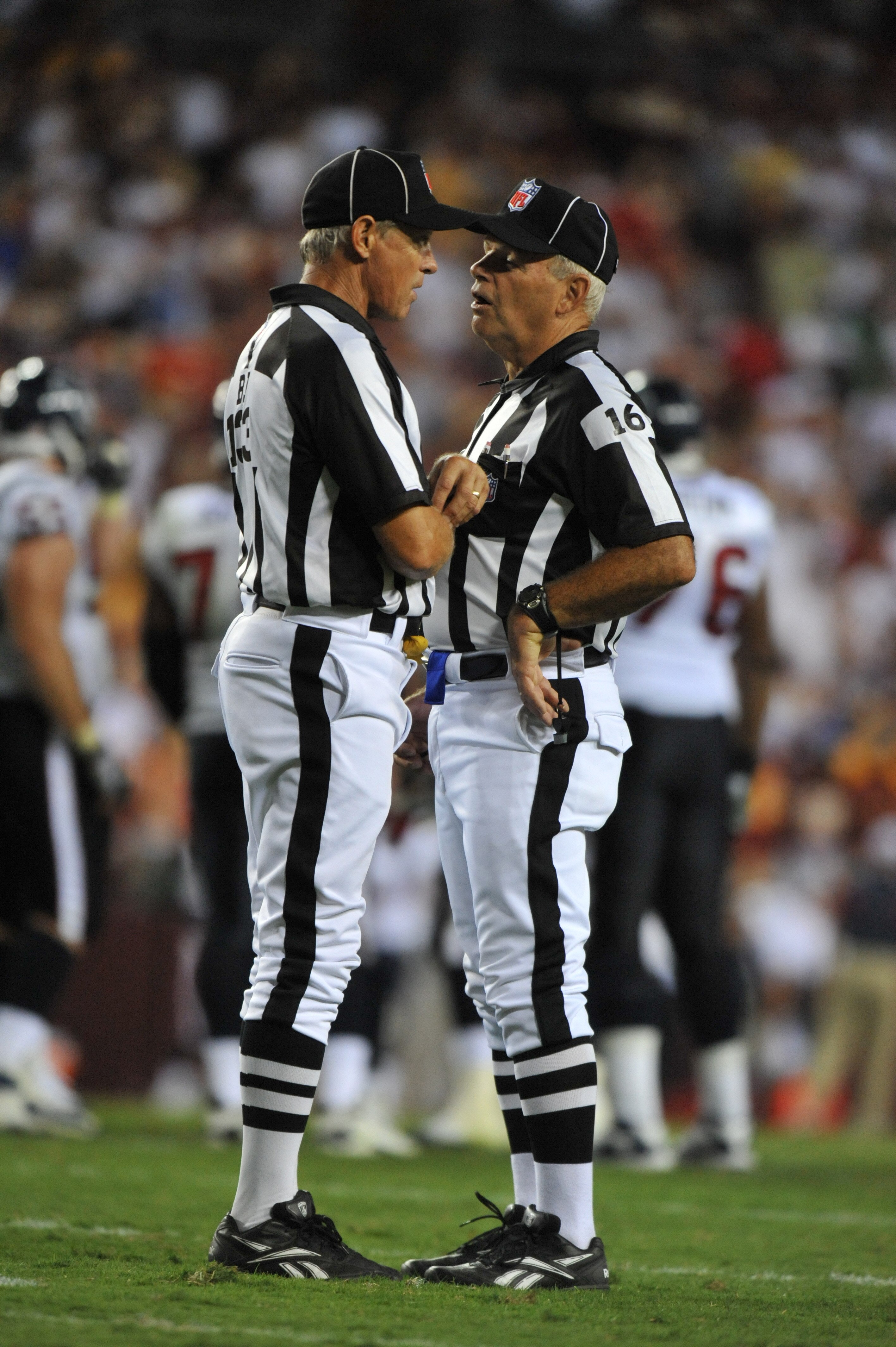 LANDOVER - SEPTEMBER 19:  Referees confer during the game between the Houston Texans and the Washington Redskins at FedExField on September 19, 2010 in Landover, Maryland. The Texans defeated the Redskins in overtime 30-27. (Photo by Larry French/Getty Im