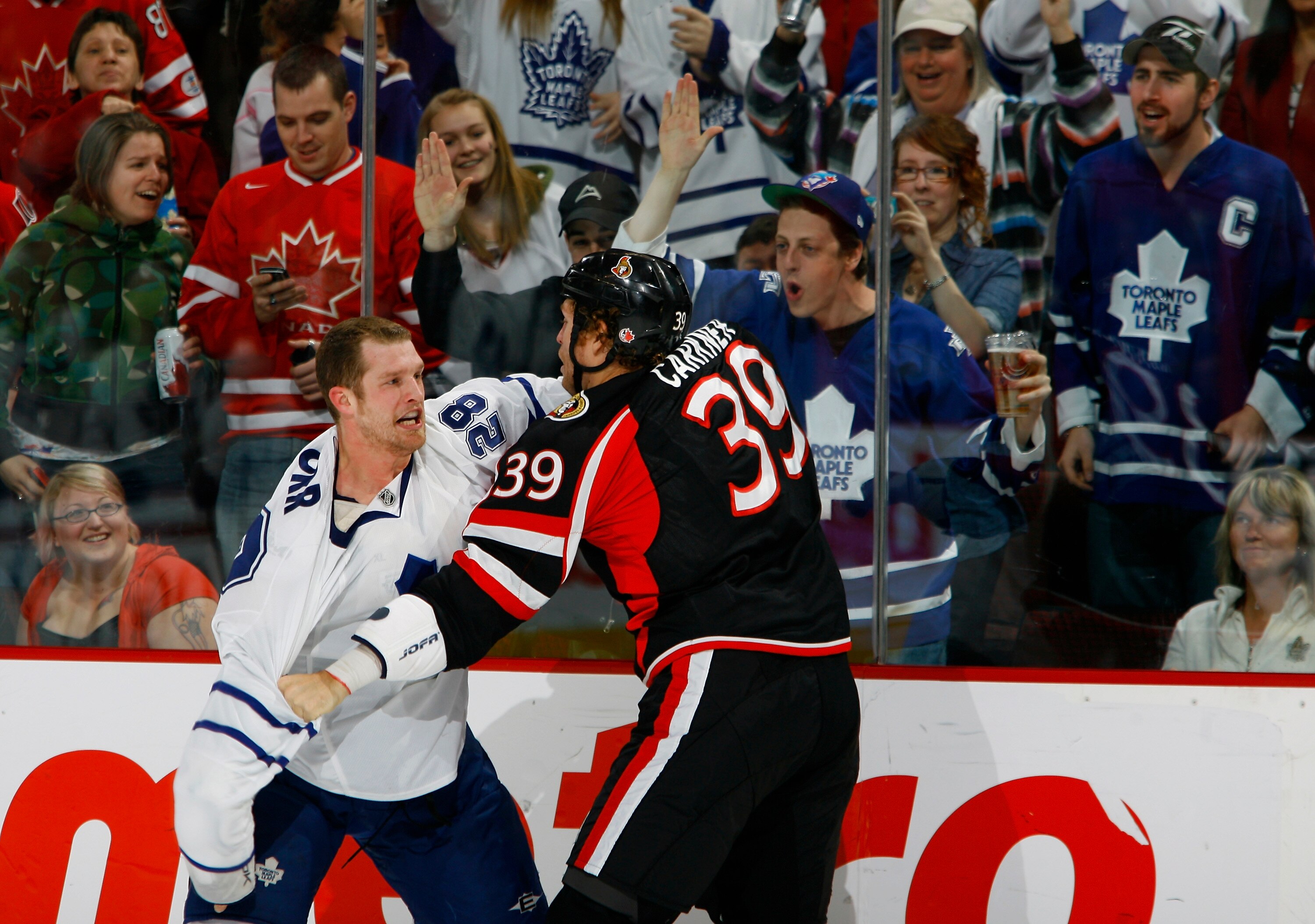 OTTAWA, ON - MARCH 6: Colton Orr #28 of the Toronto Maple Leafs and Matt Carkner #39 of the Ottawa Senators fight in front a a group of excited fans in a game at Scotiabank Place on March 6, 2010 in Ottawa, Canada. (Photo by Phillip MacCallum/Getty Image OTTAWA, ON - MARCH 6: Colton Orr #28 of the Toronto Maple Leafs and Matt Carkner #39 of the Ottawa Senators fight in front a a group of excited fans in a game at Scotiabank Place on March 6, 2010 in Ottawa, Canada. (Photo by Phillip MacCallum/Getty Image