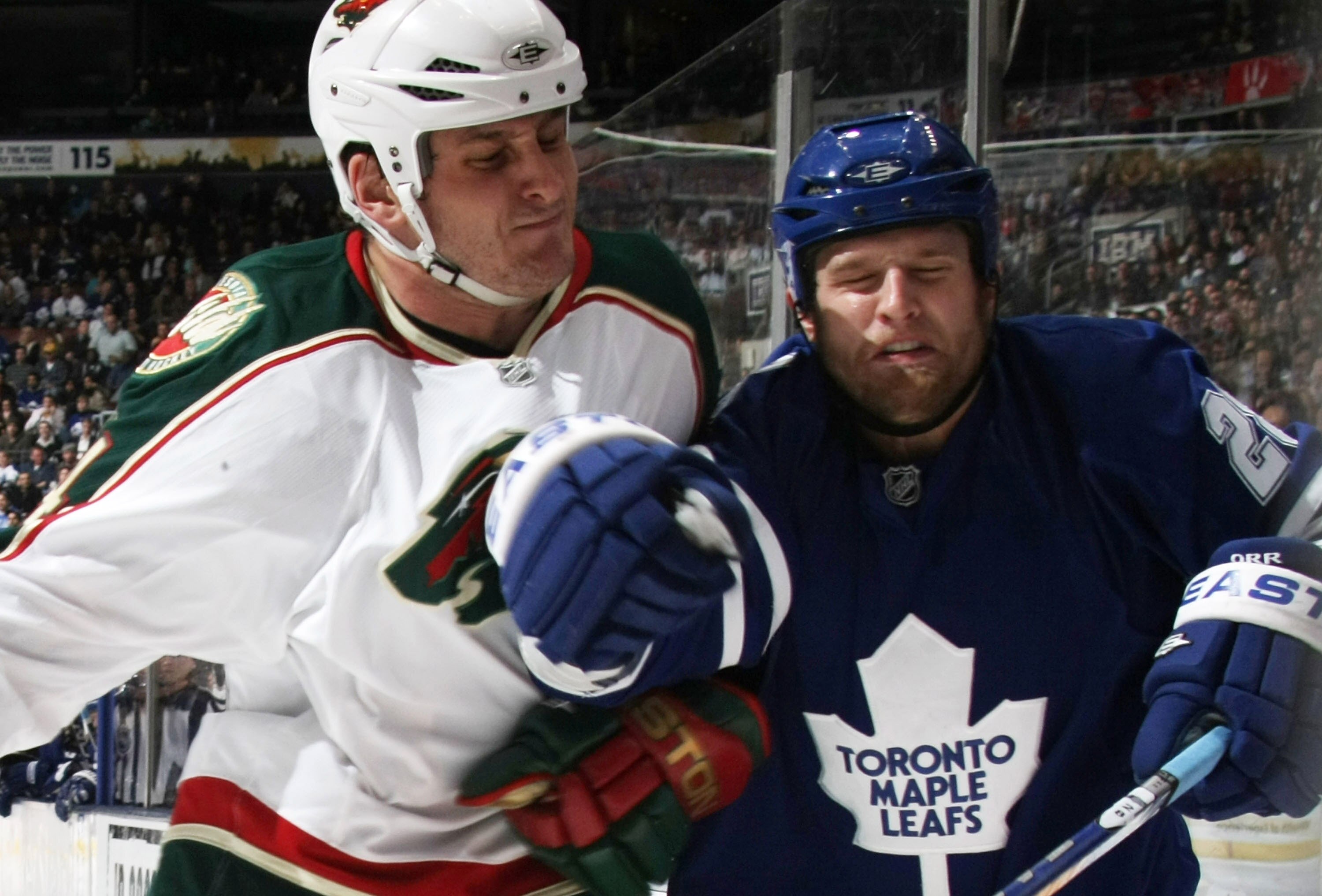 TORONTO, ON - NOVEMBER 10: Colton Orr #28 of the Toronto Maple Leafs is hit by Derek Boogaard #24 of the Minnesota Wild at the Air Canada Centre on November 10, 2009 in Toronto, Canada. (Photo by Bruce Bennett/Getty Images) TORONTO, ON - NOVEMBER 10: Colton Orr #28 of the Toronto Maple Leafs is hit by Derek Boogaard #24 of the Minnesota Wild at the Air Canada Centre on November 10, 2009 in Toronto, Canada. (Photo by Bruce Bennett/Getty Images)