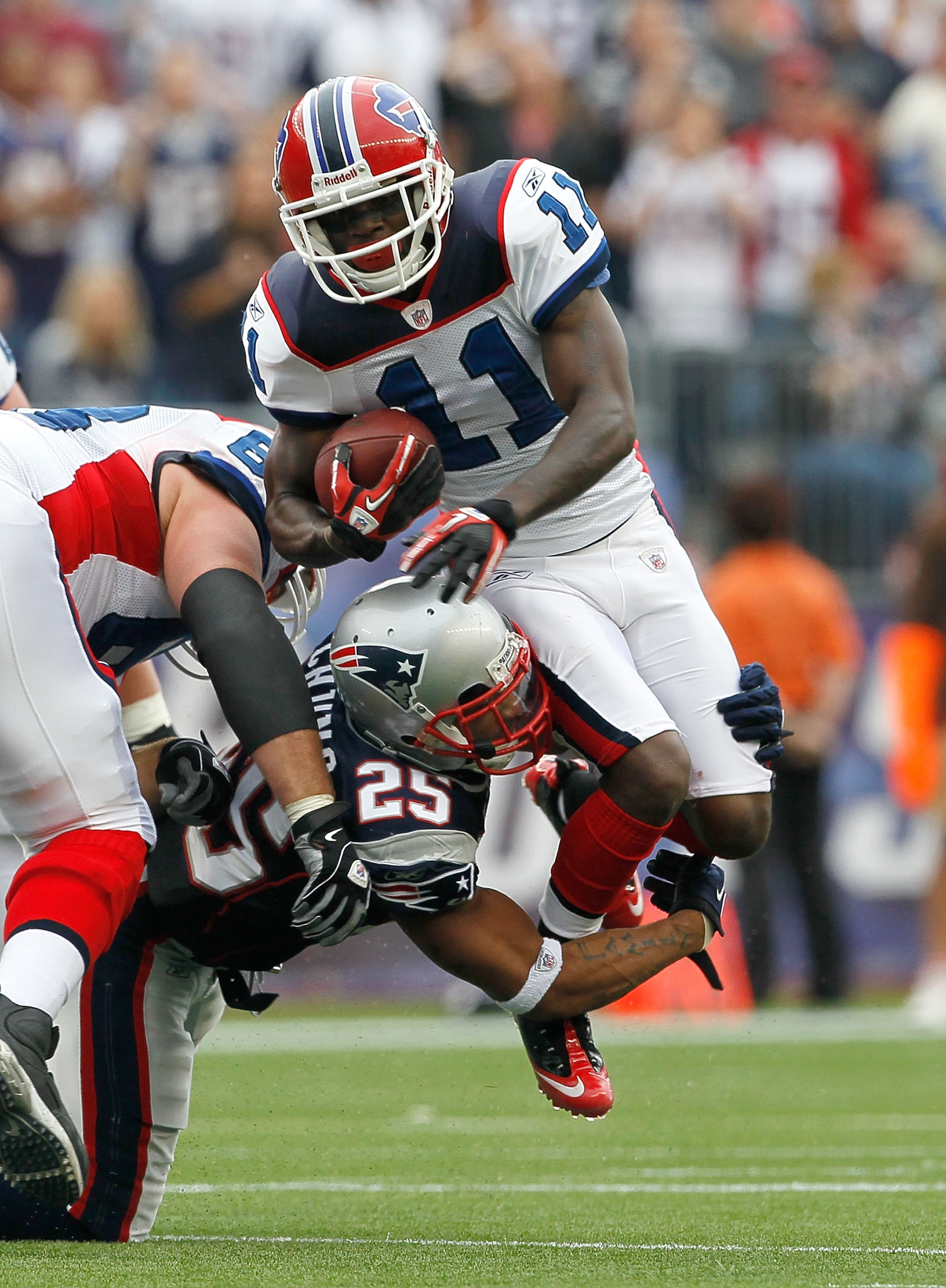 FOXBORO, MA - SEPTEMBER 26:  Patrick Chung #25 of the New England Patriots brings down Roscoe Parrish #11 of the Buffalo Bills in the second half at Gillette Stadium on September 26, 2010 in Foxboro, Massachusetts. (Photo by Jim Rogash/Getty Images)