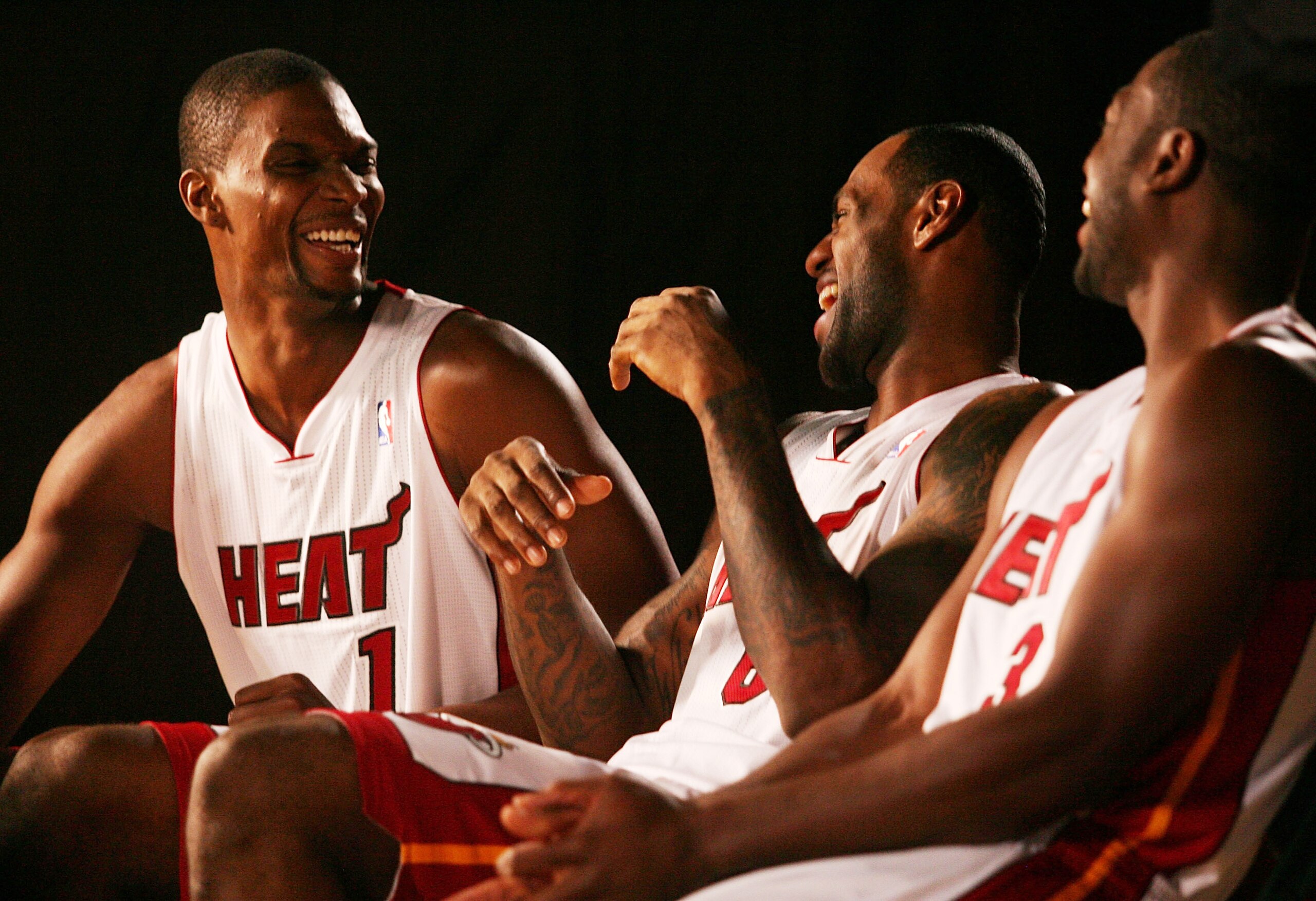MIAMI - SEPTEMBER 27:  (L-R) Chris Bosh, LeBron James and Dwyane Wade of the Miami Heat answers questions during media day at the Bank United Center on September 27, 2010 in Miami, Florida.  (Photo by Marc Serota/Getty Images)