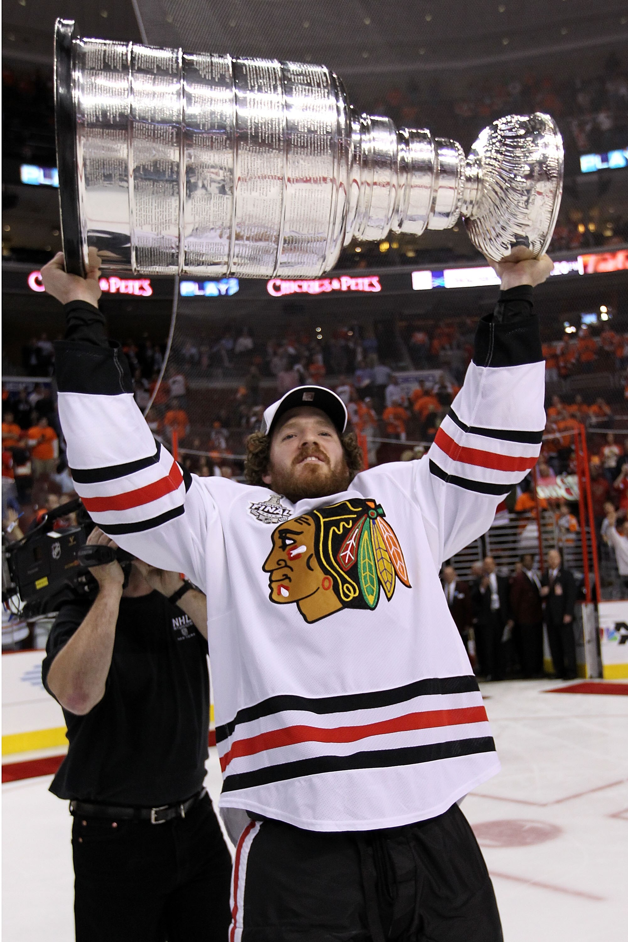 PHILADELPHIA - JUNE 09:  Colin Fraser #46 of the Chicago Blackhawks hoists the Stanley Cup after teammate Patrick Kane #88 scored the game-winning goal in overtime to defeat the Philadelphia Flyers 4-3 and win the Stanley Cup in Game Six of the 2010 NHL S