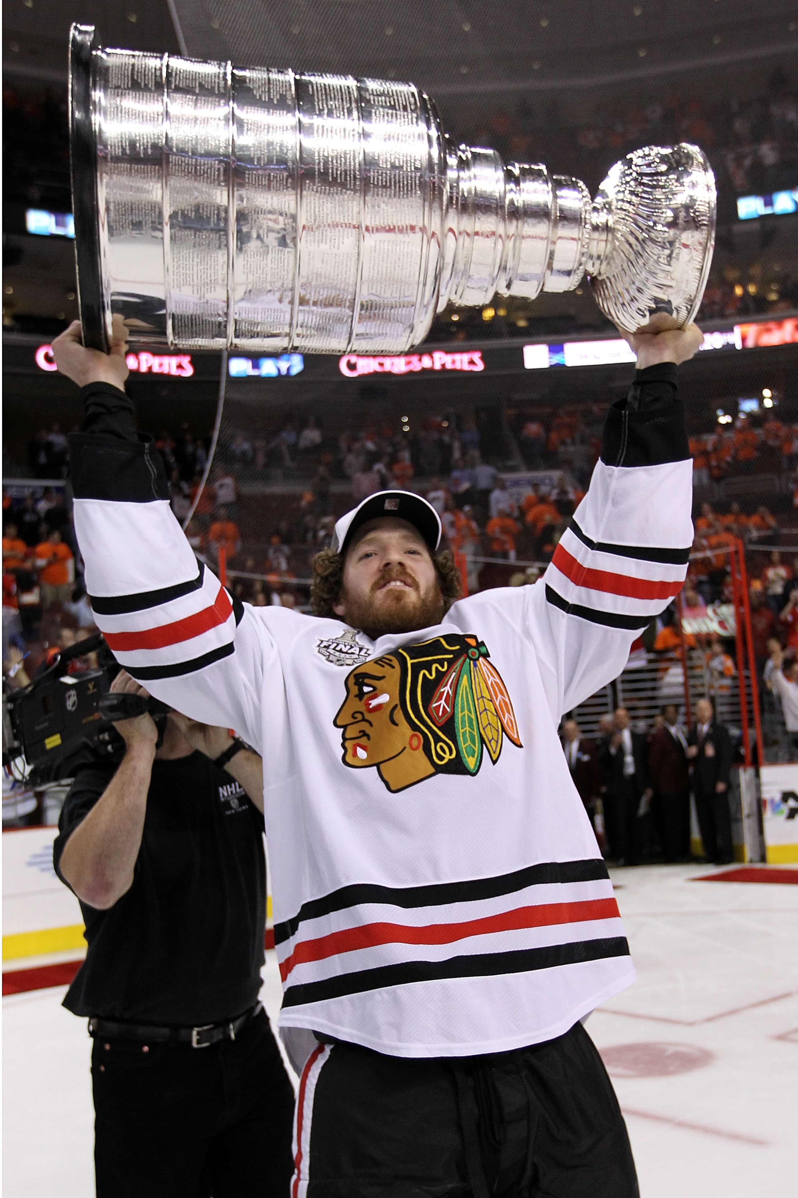 PHILADELPHIA - JUNE 09:  Colin Fraser #46 of the Chicago Blackhawks hoists the Stanley Cup after teammate Patrick Kane #88 scored the game-winning goal in overtime to defeat the Philadelphia Flyers 4-3 and win the Stanley Cup in Game Six of the 2010 NHL S