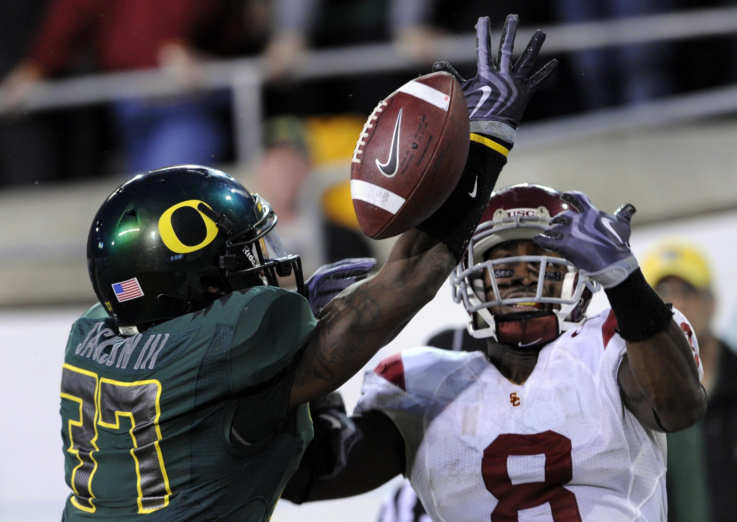 EUGENE, OR - OCTOBER 31:  Cornerback Talmadge Jackson III of the Oregon Ducks breaks up a pass in the end zone intended for wide receiver Ronald Johnson #8 Of the USC Trojans in the second quarter of the game at Autzen Stadium on October 31, 2009 in Eugen