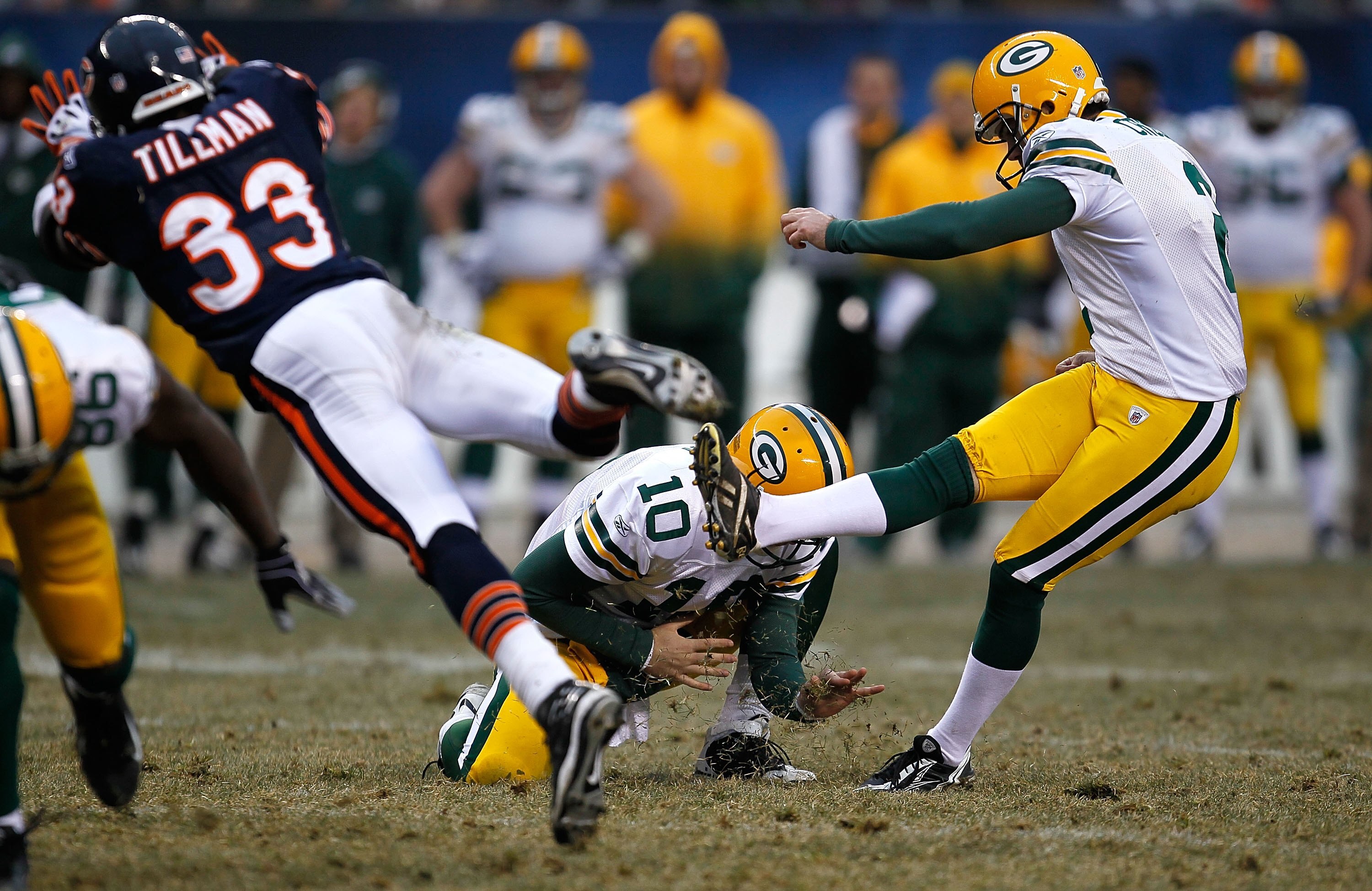 CHICAGO - DECEMBER 13: Charles Tillman #33 of the Chicago Bears tries to block a field goal attempt by Mason Crosby #2 of the Green Bay Packers out of the hold of Matt Flynn #10 at Soldier Field on December 13, 2009 in Chicago, Illinois. The Packers defea