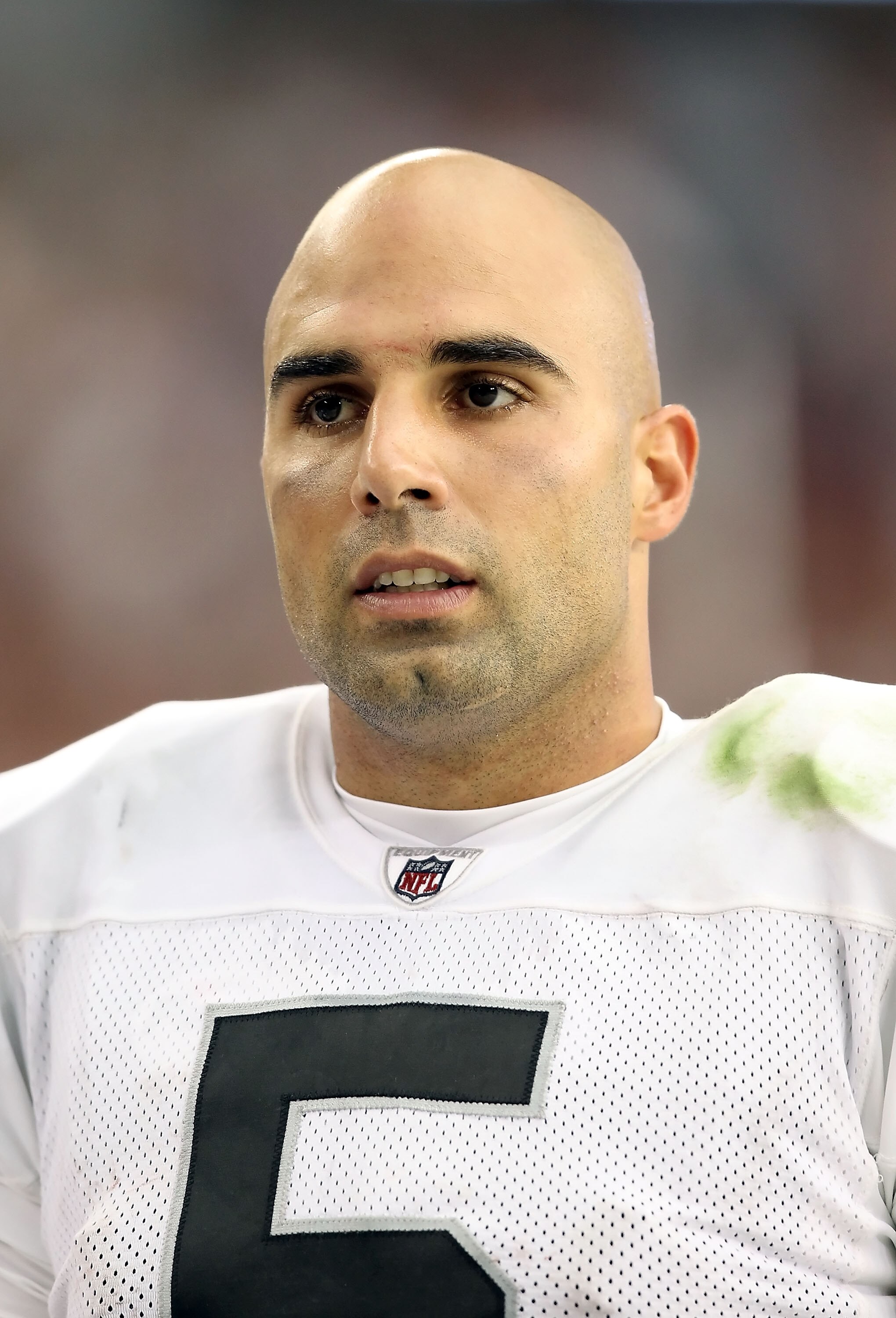 GLENDALE, AZ - SEPTEMBER 26: Quarterback Bruce Gradkowski #5 of the Oakland Raiders walks the sidelines during the NFL game against the Arizona Cardinals at the University of Phoenix Stadium on September 26, 2010 in Glendale, Arizona. The Cardinals defe GLENDALE, AZ - SEPTEMBER 26: Quarterback Bruce Gradkowski #5 of the Oakland Raiders walks the sidelines during the NFL game against the Arizona Cardinals at the University of Phoenix Stadium on September 26, 2010 in Glendale, Arizona. The Cardinals defe