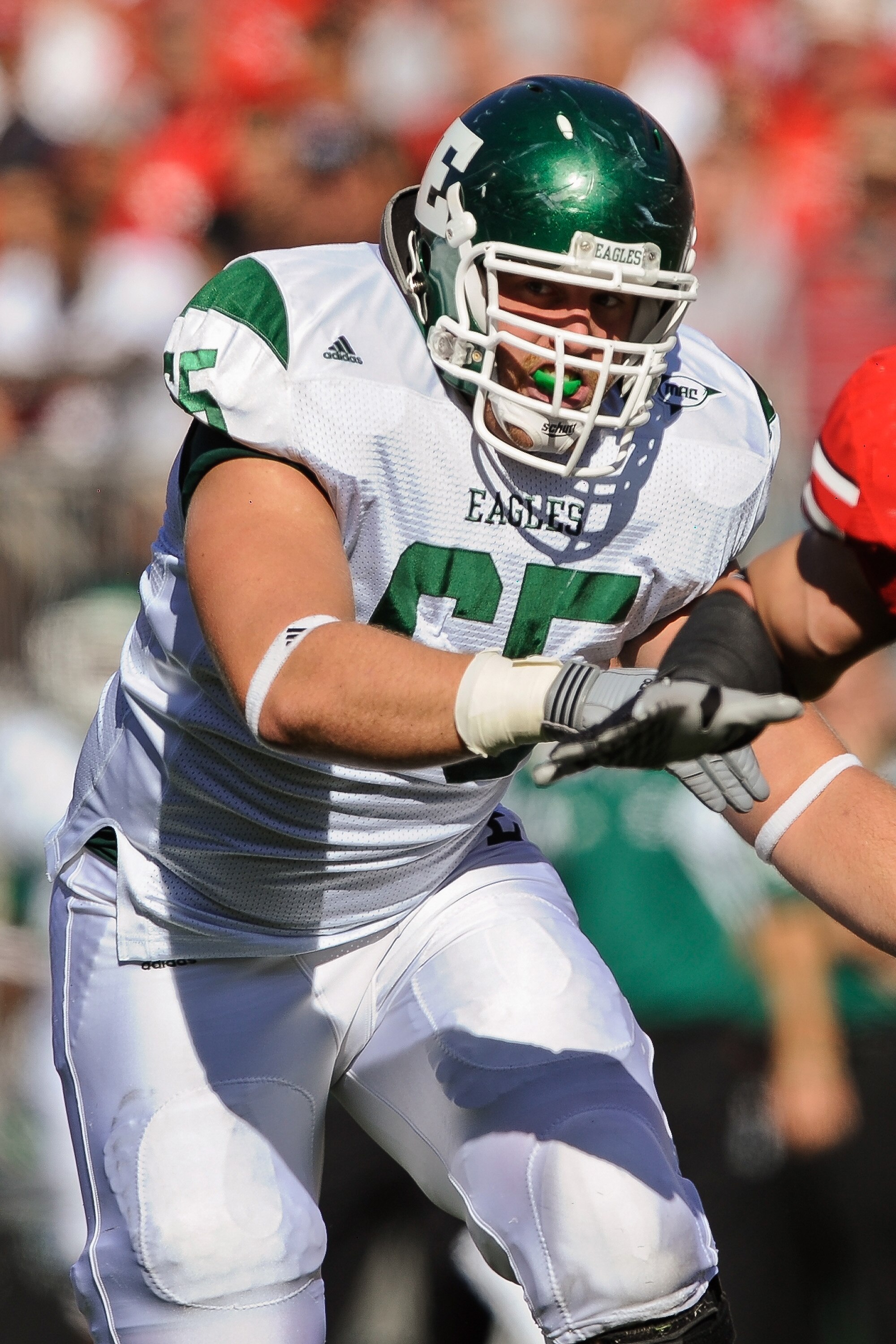 COLUMBUS, OH - SEPTEMBER 25:  Dan DeMaster #65 of the Eastern Michigan Eagles blocks against the Ohio State Buckeys at Ohio Stadium on September 25, 2010 in Columbus, Ohio.  Ohio State won 73-20. (Photo by Jamie Sabau/Getty Images)