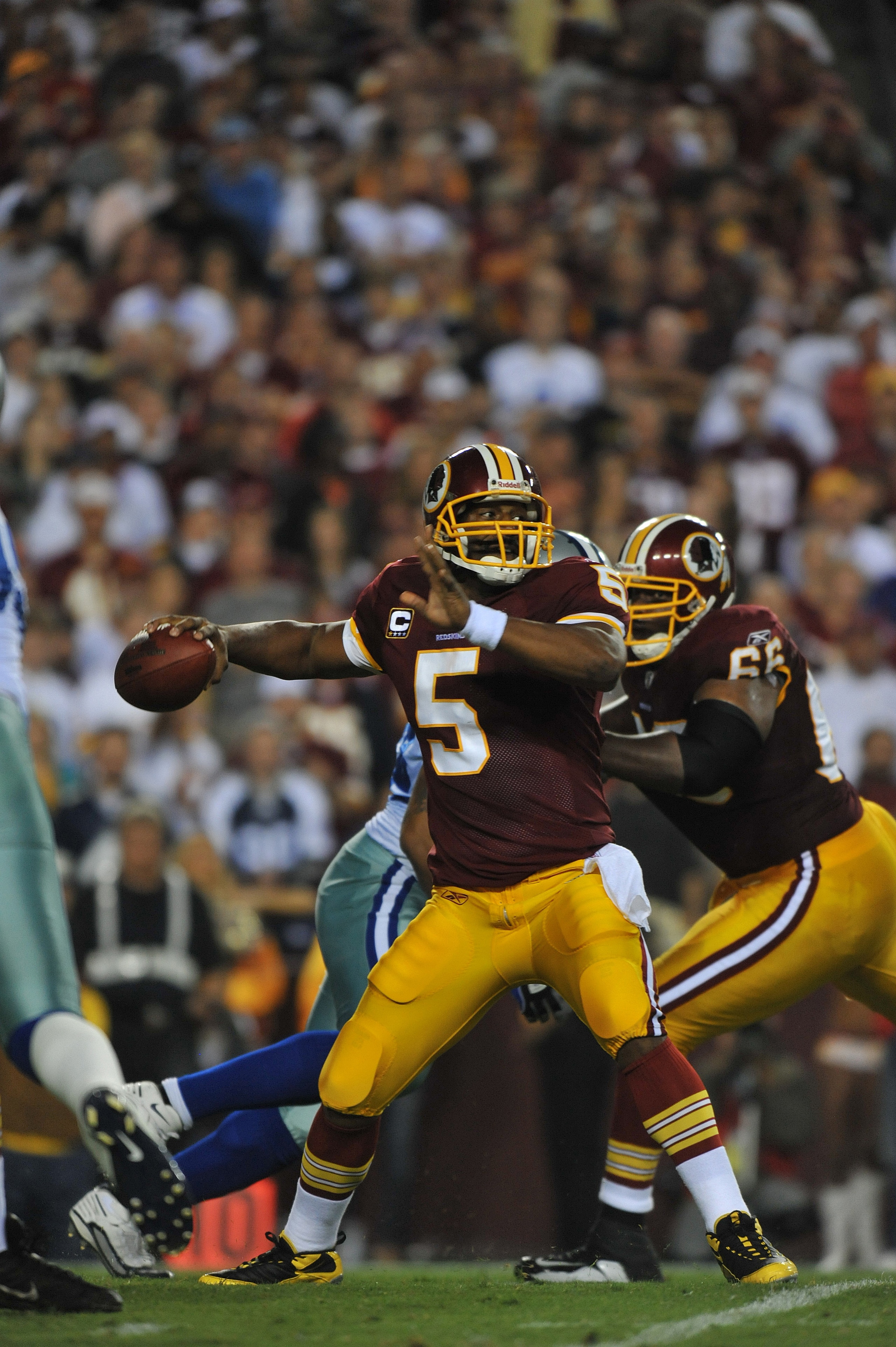 LANDOVER - SEPTEMBER 12:  Donovan McNabb #5 of the Washington Redskins passes during the NFL season opener against the Dallas Cowboys at FedExField on September 12, 2010 in Landover, Maryland. The Redskins defeated the Cowboys 13-7. (Photo by Larry French