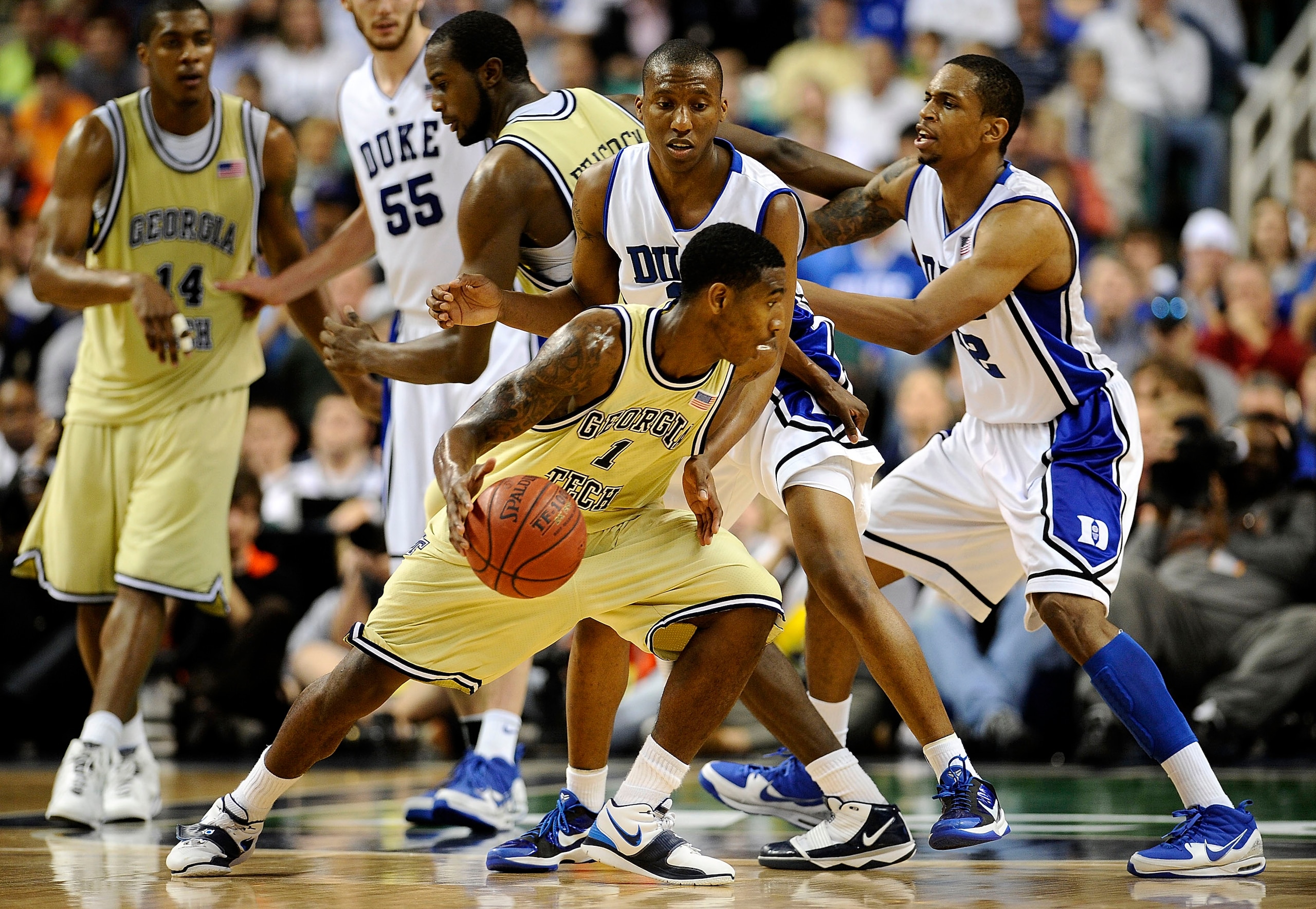 GREENSBORO, NC - MARCH 14:  Nolan Smith #2 of the Duke Blue Devils guards Iman Shumpert #1 of the Georgia Tech Yellow Jackets in the championship game of the 2010 ACC Men's Basketball Tournament at the Greensboro Coliseum on March 14, 2010 in Greensboro,
