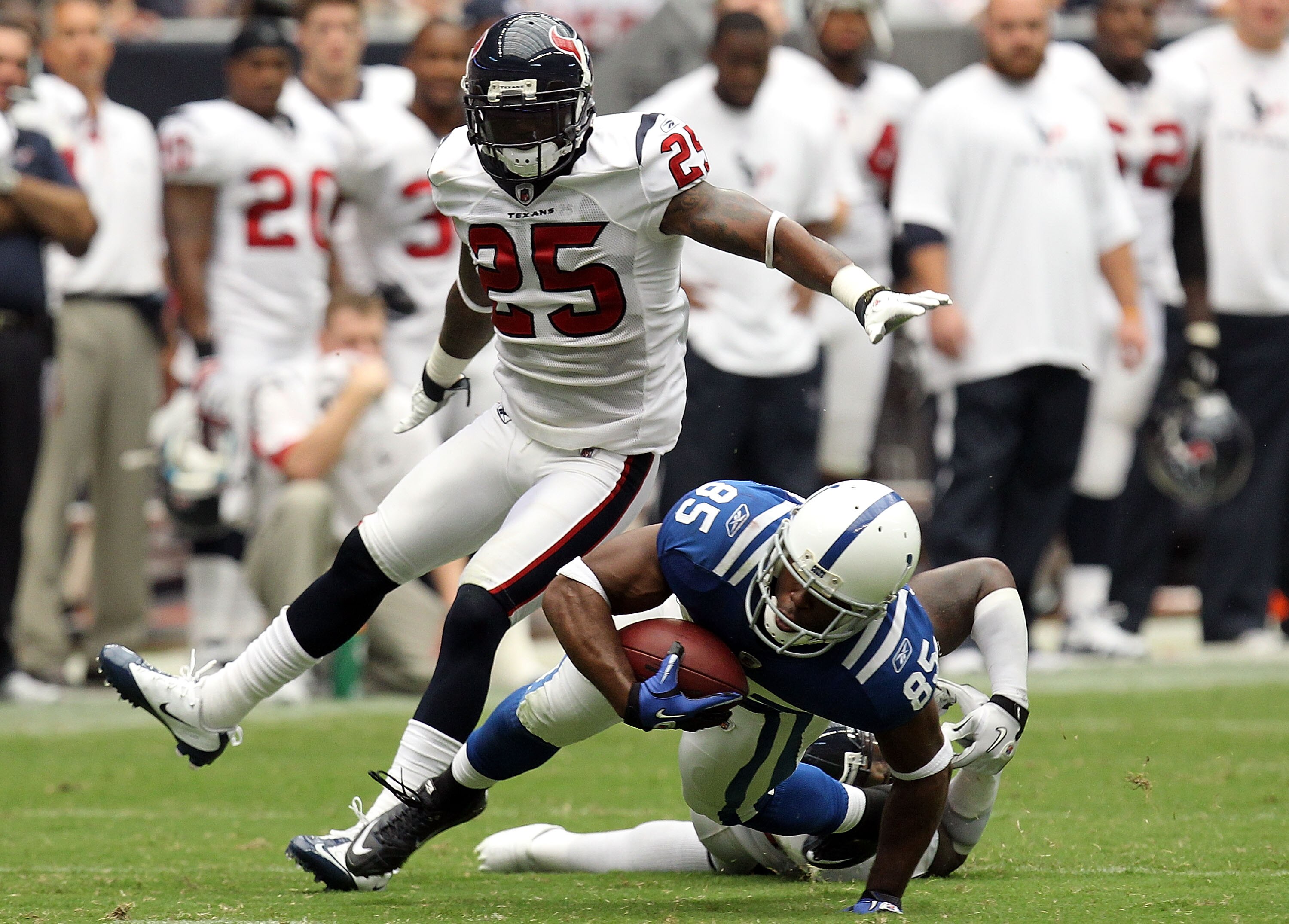 HOUSTON - SEPTEMBER 12: Wide receiver Pierre Garcon #85 of the Indianapolis Colts runs the ball against Zac Diles #54 and Kareem Jackson #25 of the Houston Texans during the NFL season opener at Reliant Stadium on September 12, 2010 in Houston, Texas. ( HOUSTON - SEPTEMBER 12: Wide receiver Pierre Garcon #85 of the Indianapolis Colts runs the ball against Zac Diles #54 and Kareem Jackson #25 of the Houston Texans during the NFL season opener at Reliant Stadium on September 12, 2010 in Houston, Texas. (