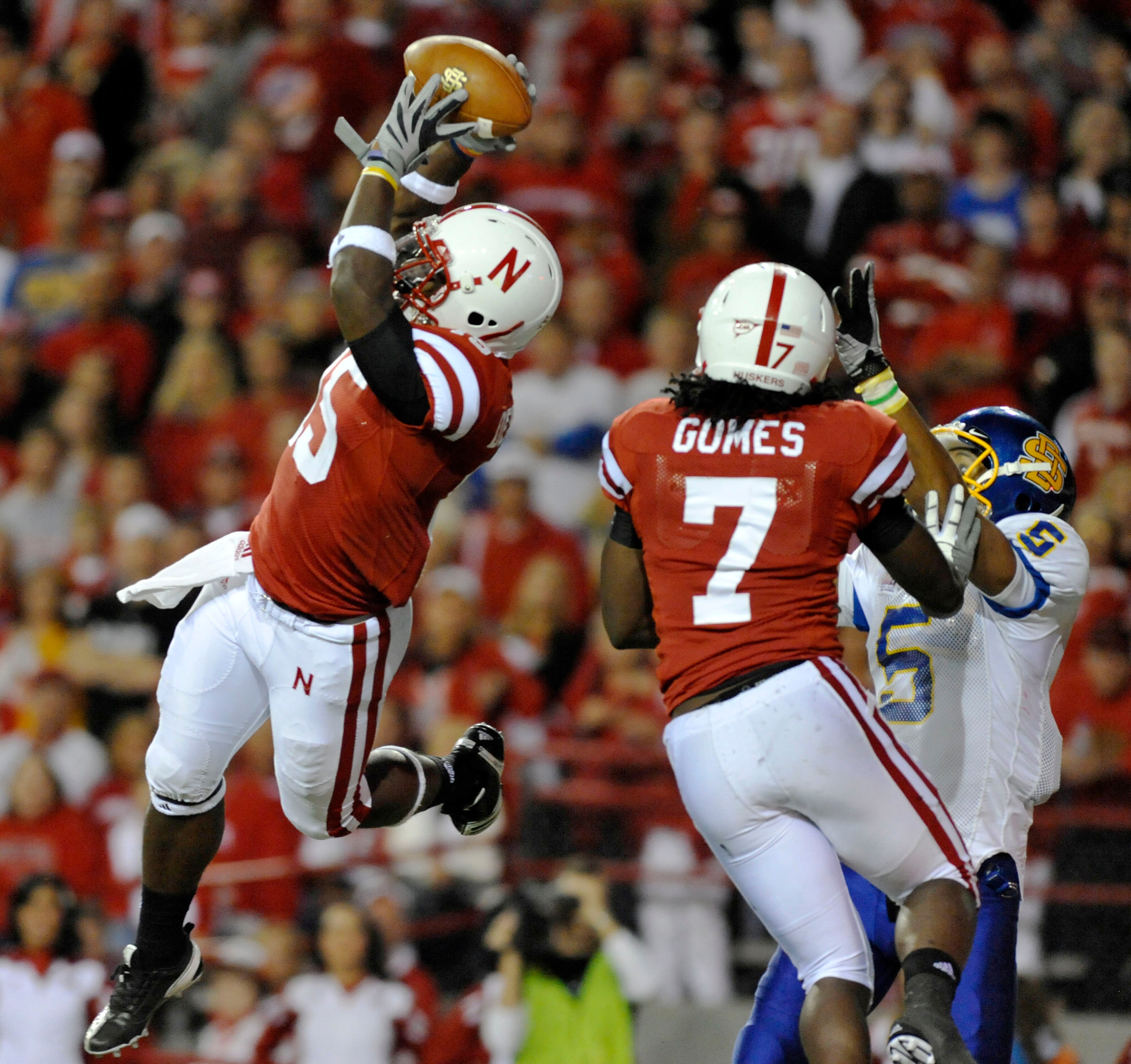 LINCOLN, NB - SEPTEMBER 25: Cornerback Alfonzo Dennard #15 of the Nebraska Cornuskers intercepts a ball from  wide receiver Aaron Rollin #5 of the South Dakota State Jackrabbits during second half action of their game at Memorial Stadium on September 25,