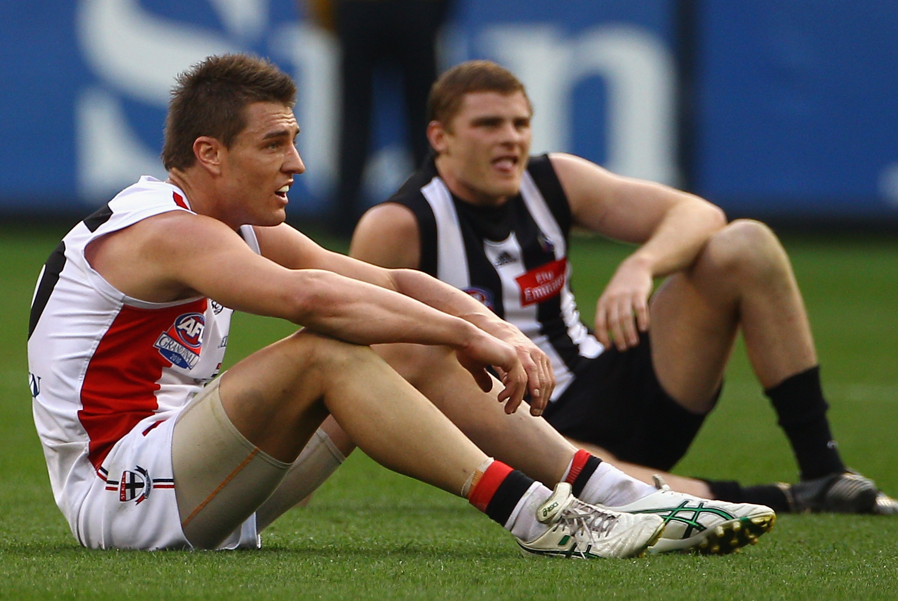 MELBOURNE, AUSTRALIA - SEPTEMBER 25:  Sam Fisher of the Saints and Heath Shaw of the Magpies react as the siren sounds at the end of the game and it is a draw during the AFL Grand Final match between the Collingwood Magpies and the St Kilda Saints at the