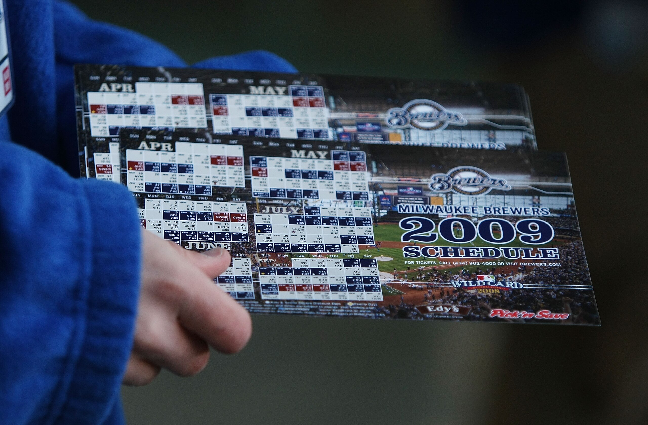 MILWAUKEE - APRIL 10: An usher prepares to hand out Milwaukee Brewers magnet schedules to fans arriving for the Opening Day game against the Chicago Cubs on April 10, 2009 at Miller Park in Milwaukee, Wisconsin. (Photo byJonathan Daniel/Getty Images)