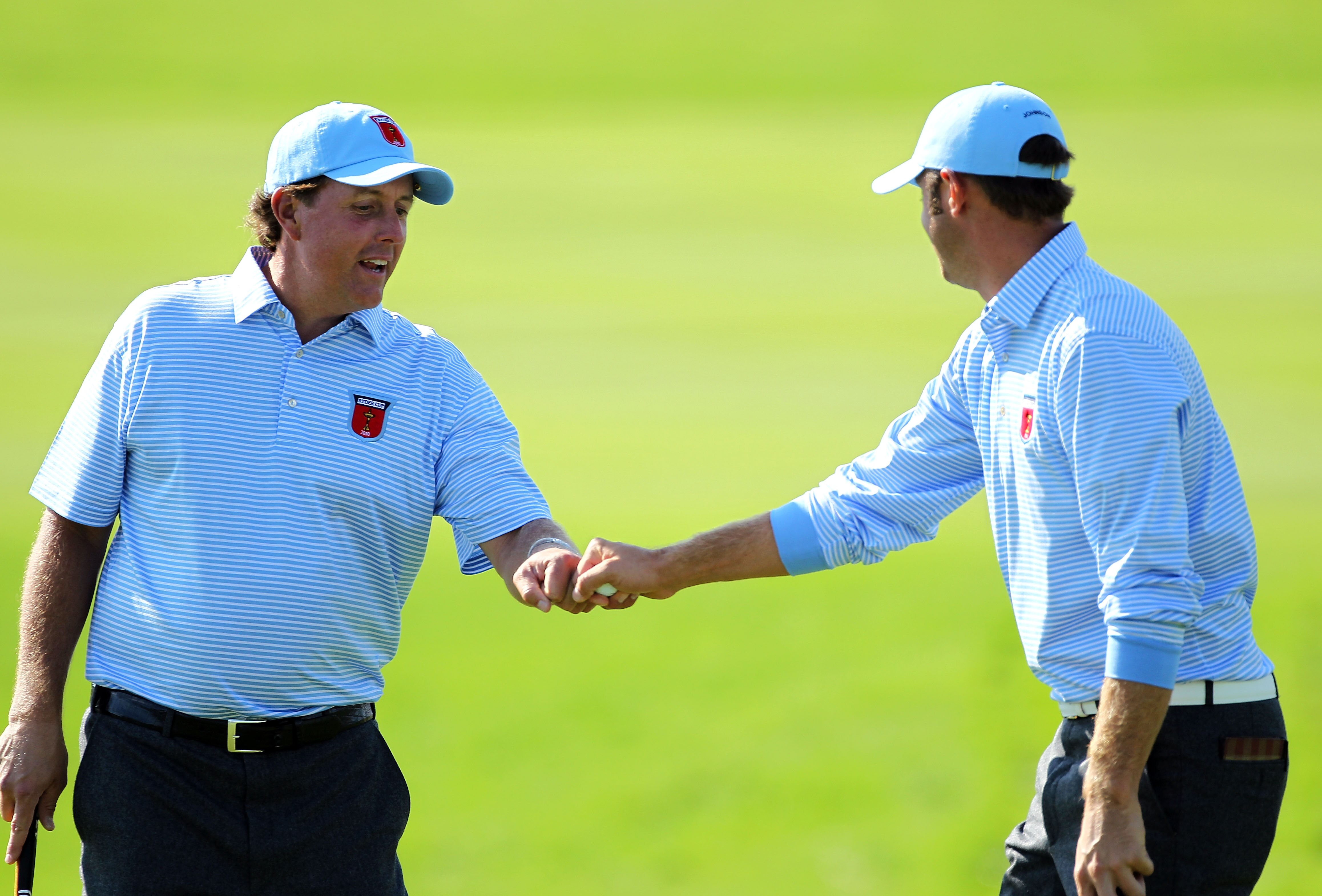 NEWPORT, WALES - SEPTEMBER 28:  Phil Mickelson of the USA (L) celebrates a putt with Dustin Johnson during a practice round prior to the 2010 Ryder Cup at the Celtic Manor Resort on September 28, 2010 in Newport, Wales.  (Photo by Andy Lyons/Getty Images)