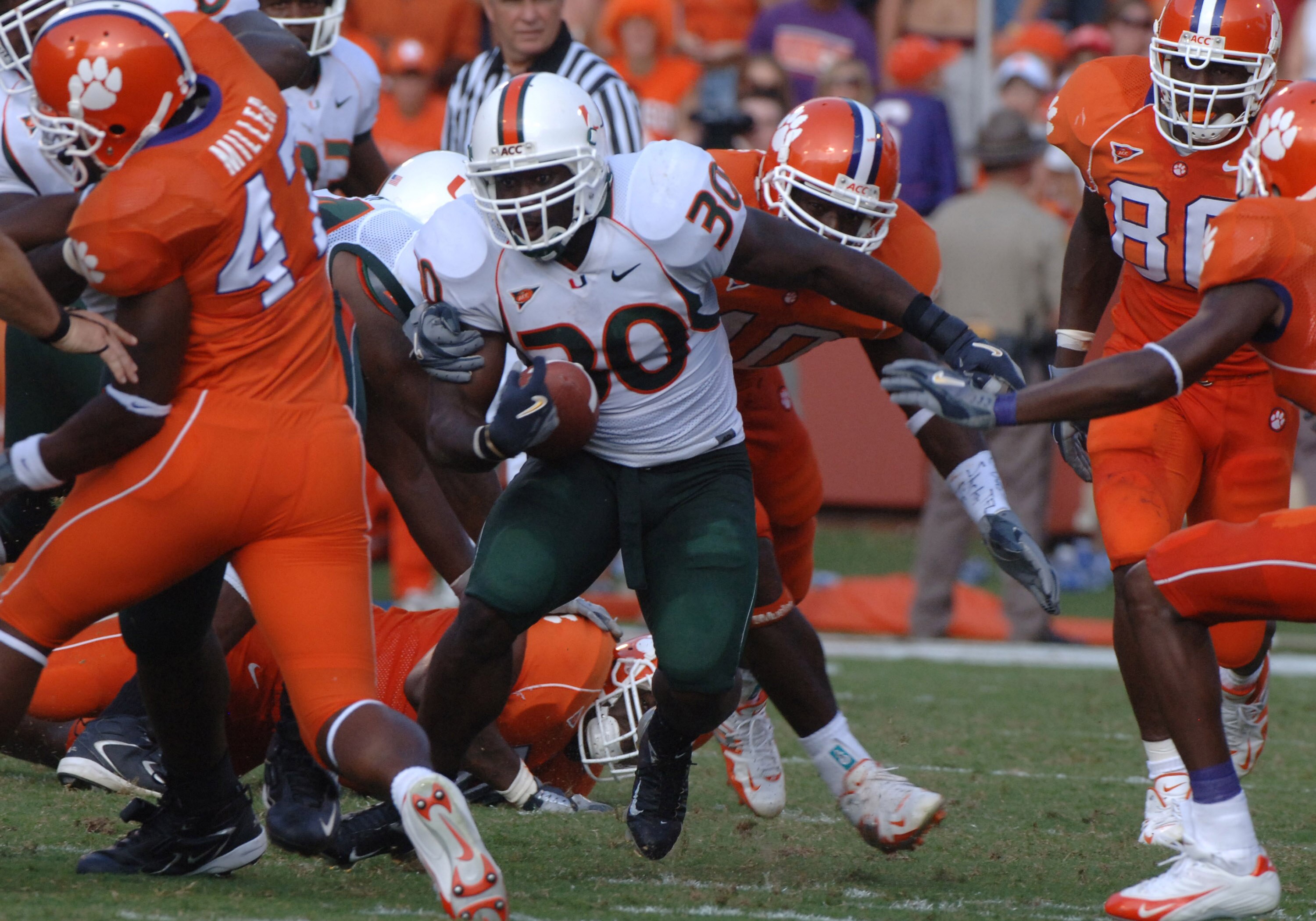 University of Miami   running back Tyrone Moss rushes for a gain against Clemson September 17, 2005 at Clemson. (Photo by A. Messerschmidt/Getty Images)
