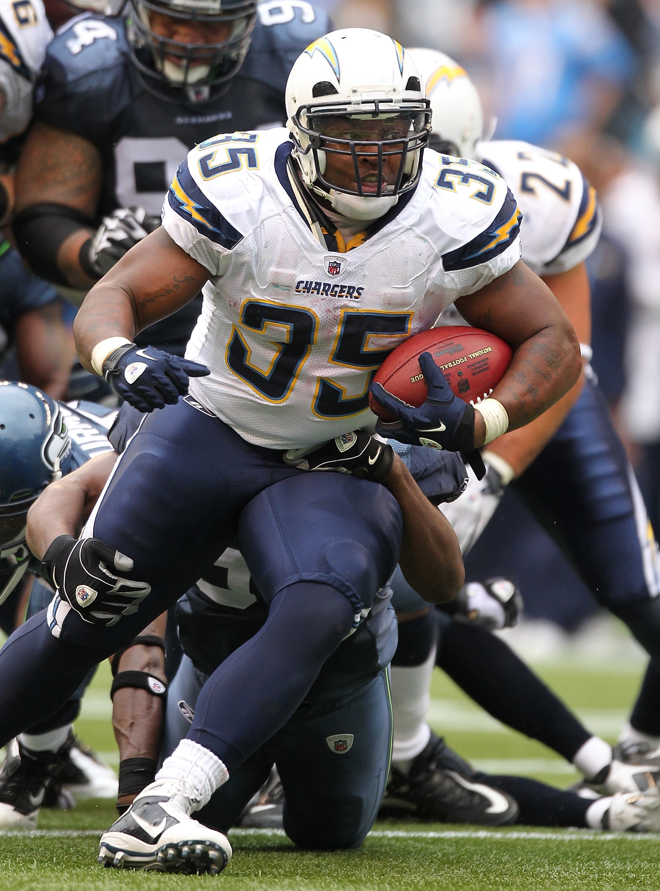 SEATTLE - SEPTEMBER 26:  Running back Mike Tolbert #35 of the San Diego Chargers rushes against the Seattle Seahawks at Qwest Field on September 26, 2010 in Seattle, Washington. The Seahawks defeated the Chargers 27-20. (Photo by Otto Greule Jr/Getty Imag