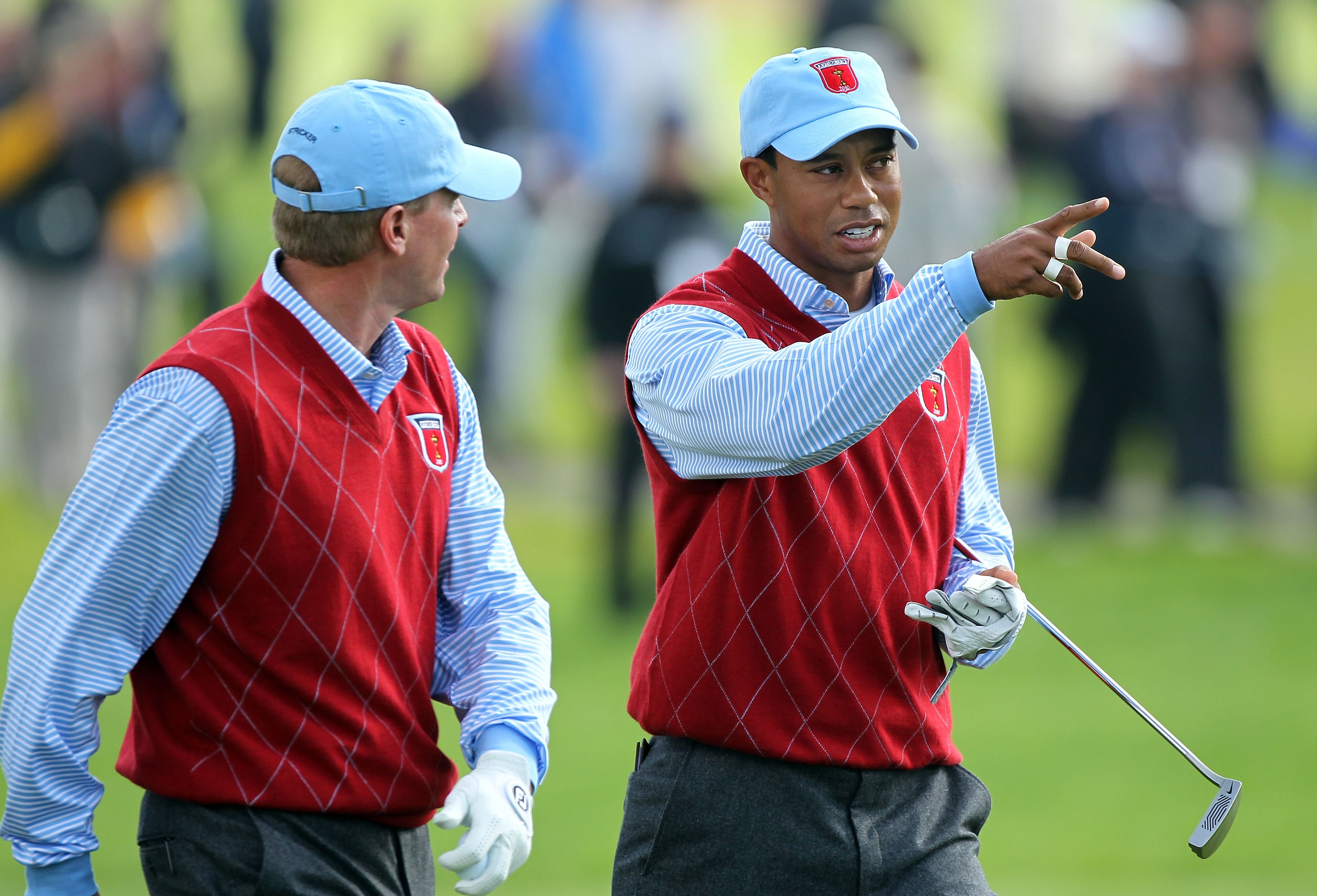 NEWPORT, WALES - SEPTEMBER 28:  Tiger Woods of the USA chats with Steve Stricker (L) during a practice round prior to the 2010 Ryder Cup at the Celtic Manor Resort on September 28, 2010 in Newport, Wales.  (Photo by Andy Lyons/Getty Images)