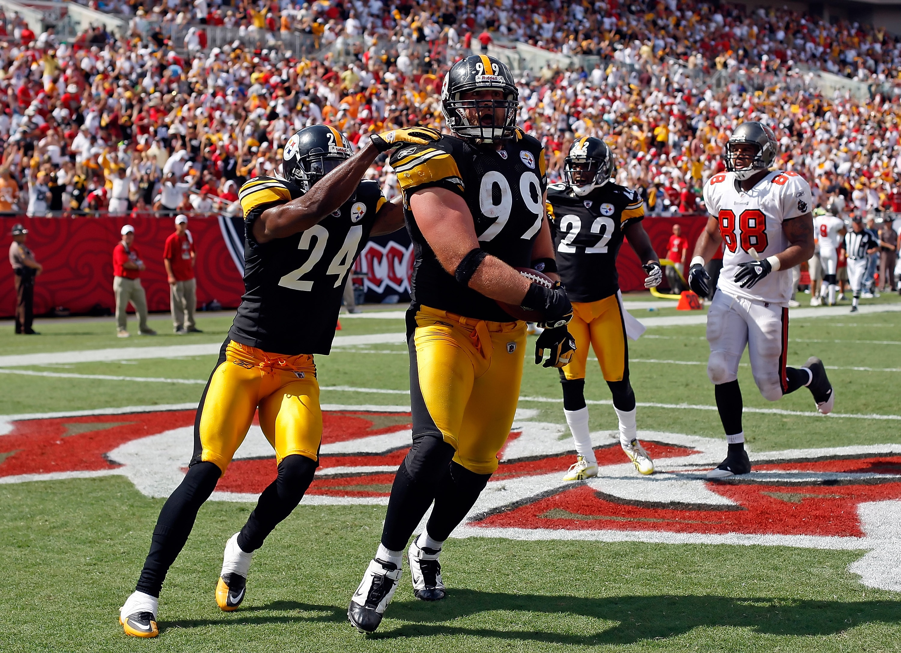 TAMPA, FL - SEPTEMBER 26:  Defensive end Brett Keisel #99 of the Pittsburgh Steelers scores a touchdown after incepting a pass against the Tampa Bay Buccaneers during the game at Raymond James Stadium on September 26, 2010 in Tampa, Florida. The undefeate