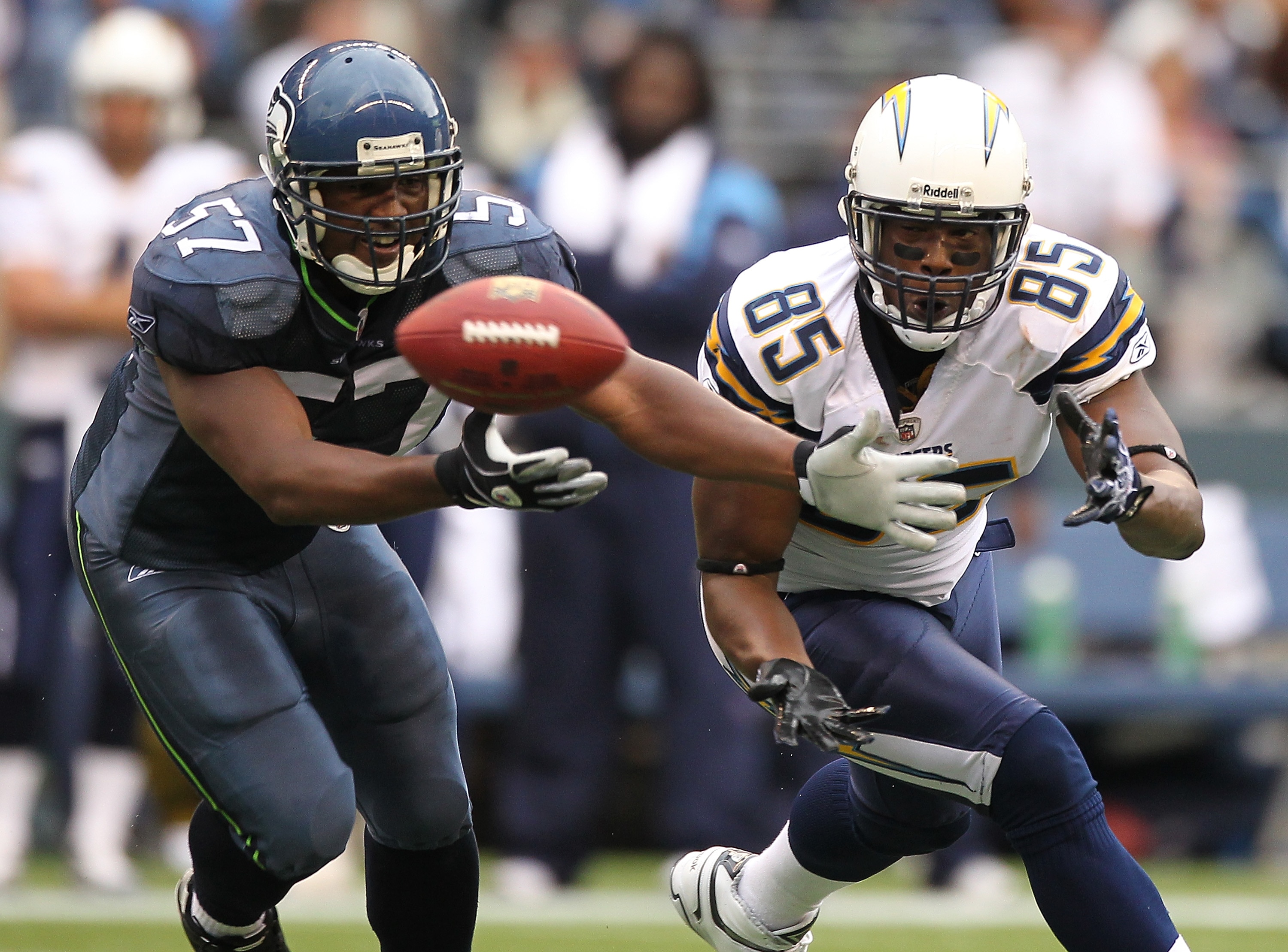 SEATTLE - SEPTEMBER 26:  Tight end Antonio Gates #85 of the San Diego Chargers attempts to catch a pass that is batted away by David Hawthorne #57 of the Seattle Seahawks at Qwest Field on September 26, 2010 in Seattle, Washington. The pass was then inter