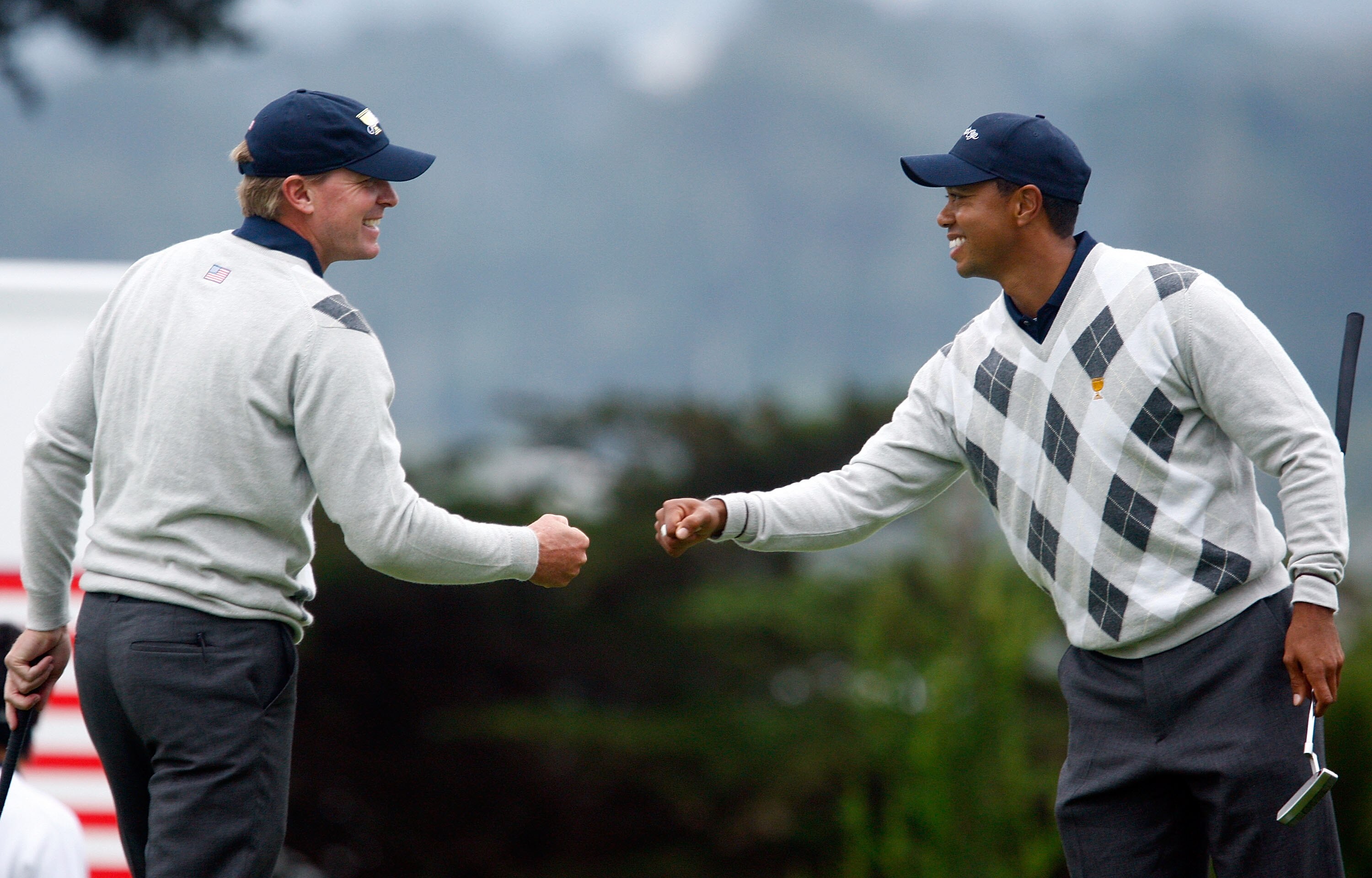 SAN FRANCISCO - OCTOBER 10:  Steve Stricker and Tiger Woods of the USA Team celebrate a birde to win the 12th hole during the Day Three Afternoon Fourball Matches of The Presidents Cup at Harding Park Golf Course on October 10, 2009 in San Francisco, Cali