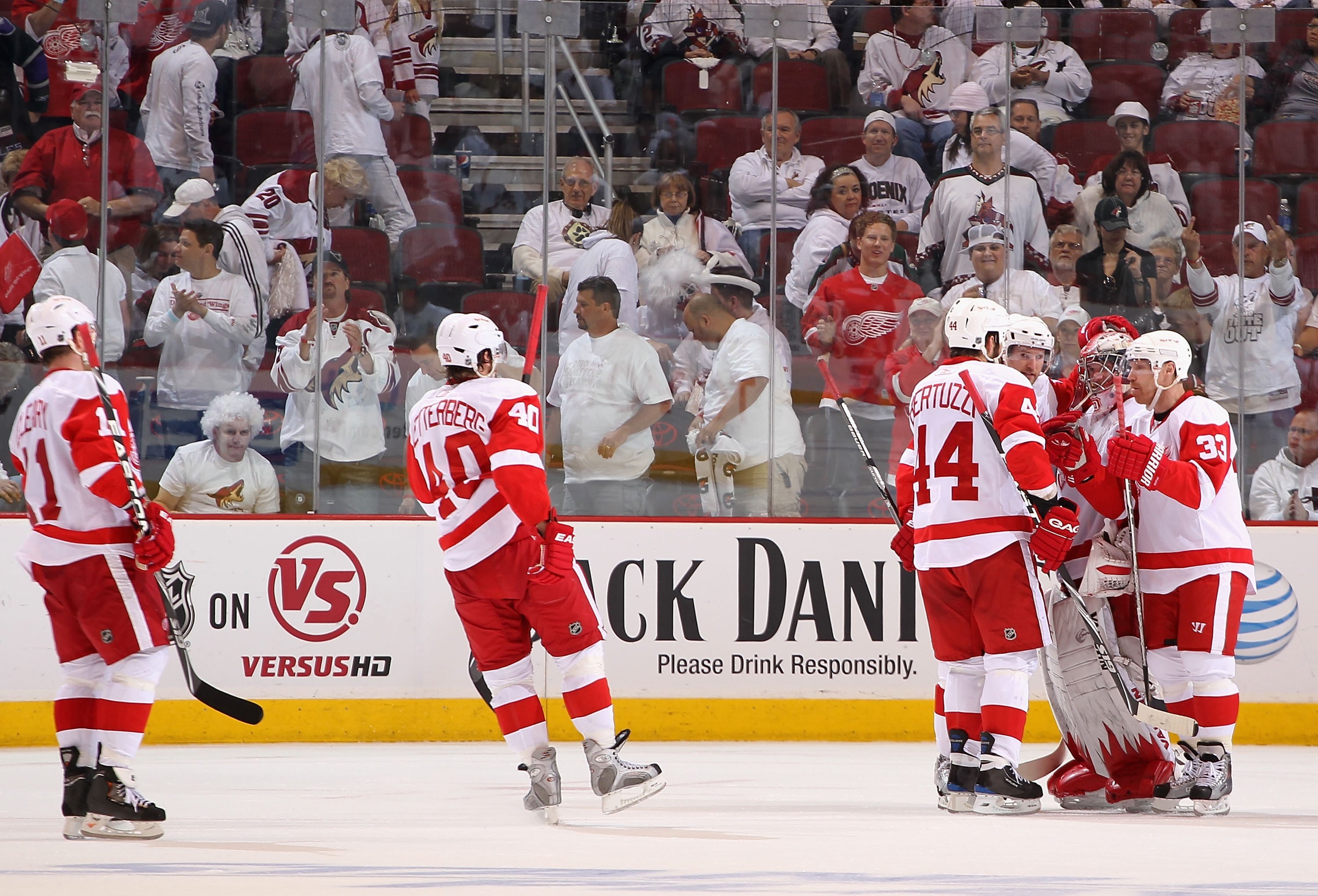 GLENDALE, AZ - APRIL 23:  Goaltender Jimmy Howard #35 of the Detroit Red Wings is congratulated by teammates after Game Five of the Western Conference Quarterfinals against the Phoenix Coyotes during the 2010 NHL Stanley Cup Playoffs at Jobing.com Arena o