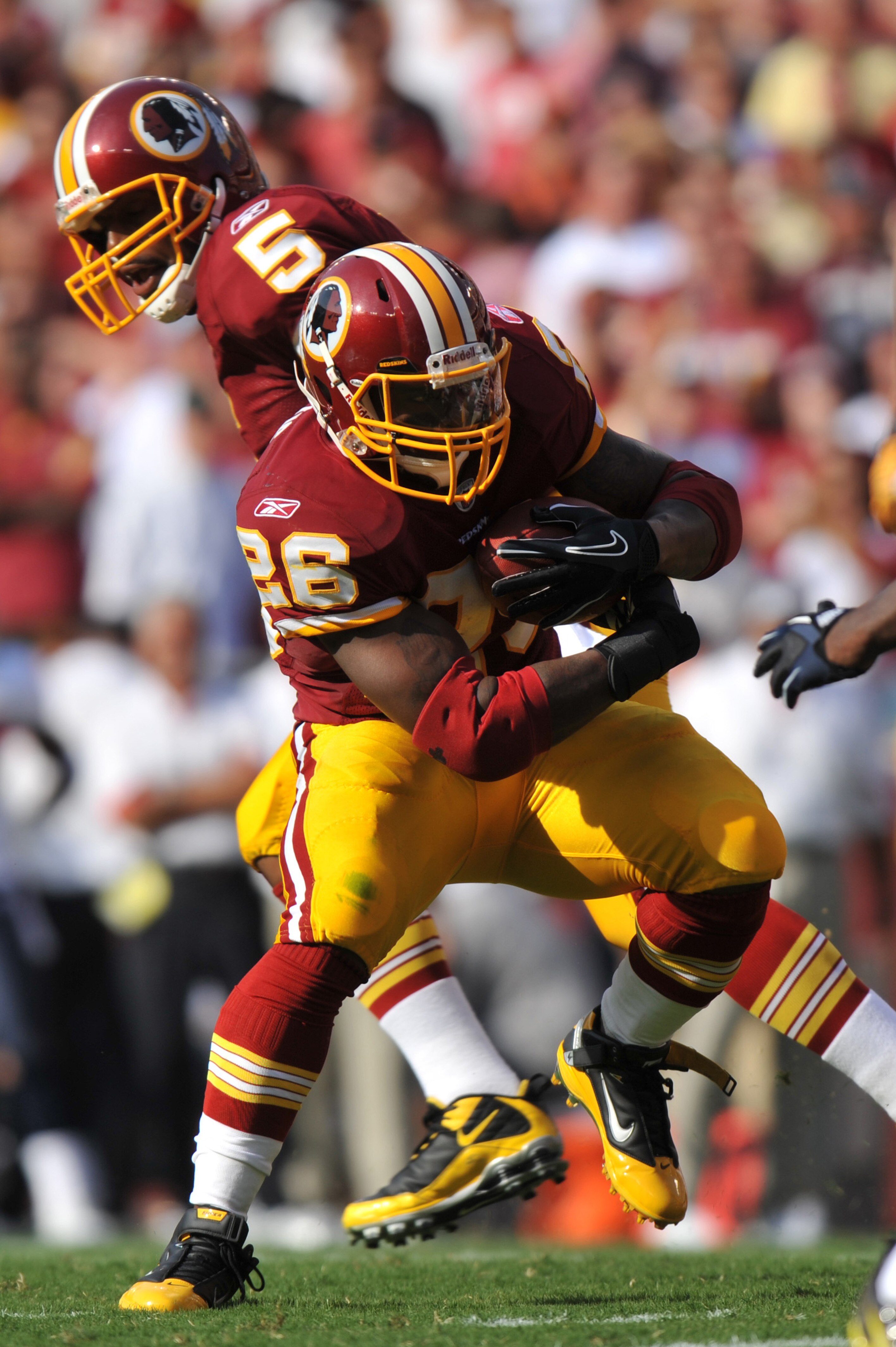 LANDOVER, MD - SEPTEMBER 19:  Clinton Portis #26 of the Washington Redskins runs the ball during the game against the Houston Texans at FedExField on September 19, 2010 in Landover, Maryland. The Texans defeated the Redskins in overtime 30-27. (Photo by L