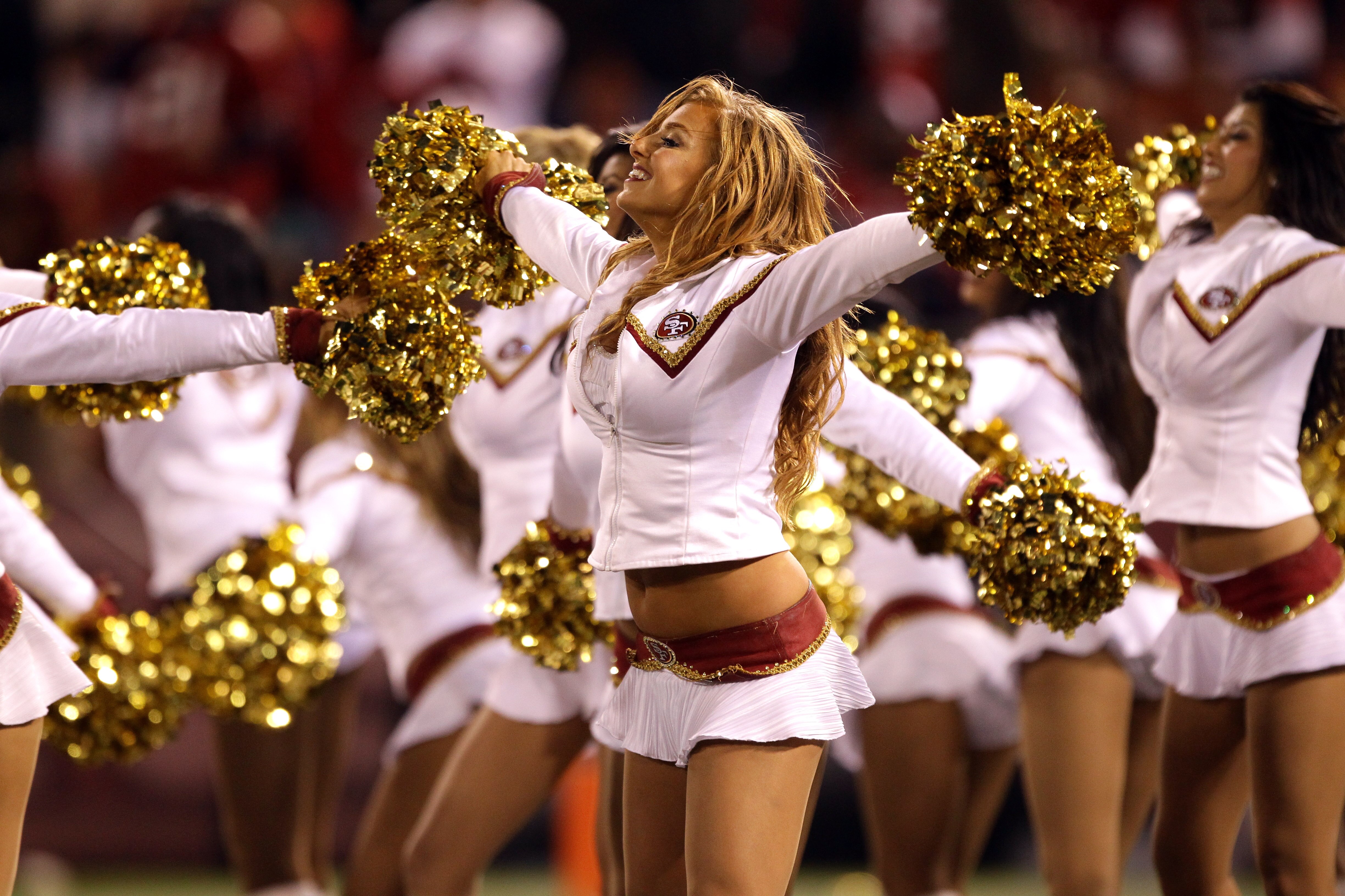SAN FRANCISCO - SEPTEMBER 20:  The Gold Rush San Francisco 49ers cheerleaders cheer for their team during their game against the New Orleans Saints at Candlestick Park on September 20, 2010 in San Francisco, California.  (Photo by Ezra Shaw/Getty Images)