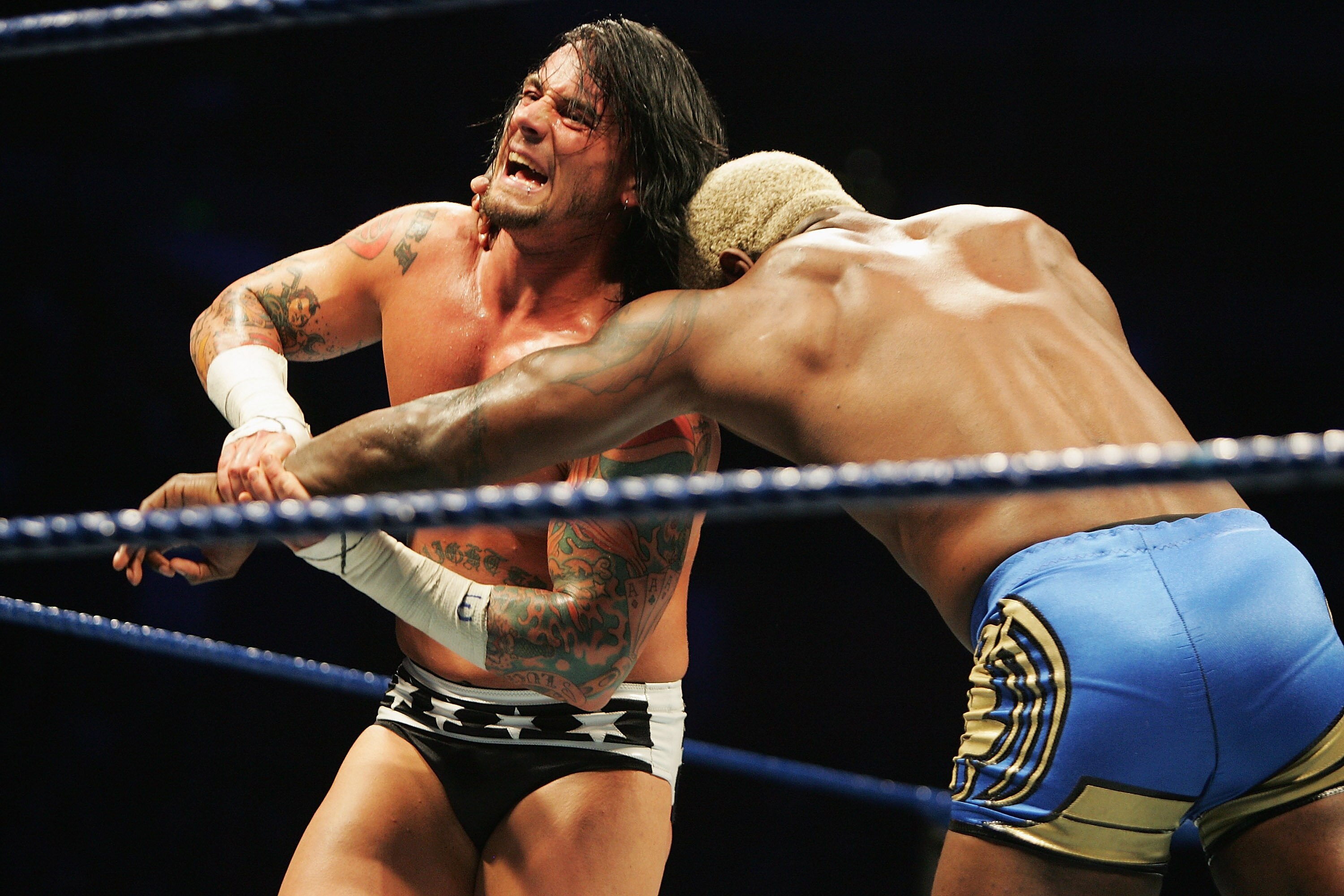 SYDNEY, AUSTRALIA - JUNE 15: CM Punk wrestles Shelton Benjamin during WWE Smackdown at Acer Arena on June 15, 2008 in Sydney, Australia. (Photo by Gaye Gerard/Getty Images) SYDNEY, AUSTRALIA - JUNE 15: CM Punk wrestles Shelton Benjamin during WWE Smackdown at Acer Arena on June 15, 2008 in Sydney, Australia. (Photo by Gaye Gerard/Getty Images)