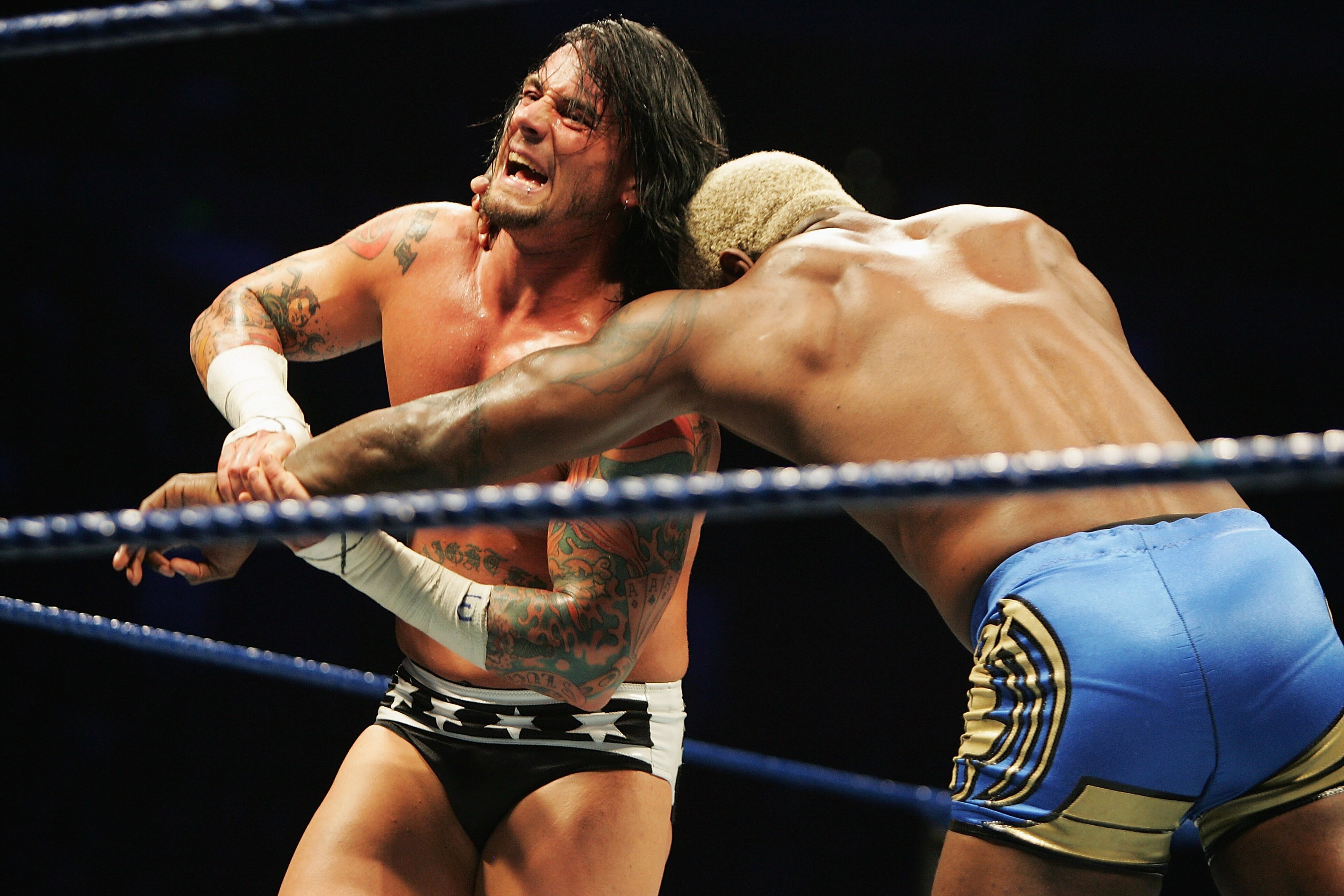 SYDNEY, AUSTRALIA - JUNE 15:  CM Punk wrestles Shelton Benjamin during WWE Smackdown at Acer Arena on June 15, 2008 in Sydney, Australia.  (Photo by Gaye Gerard/Getty Images)