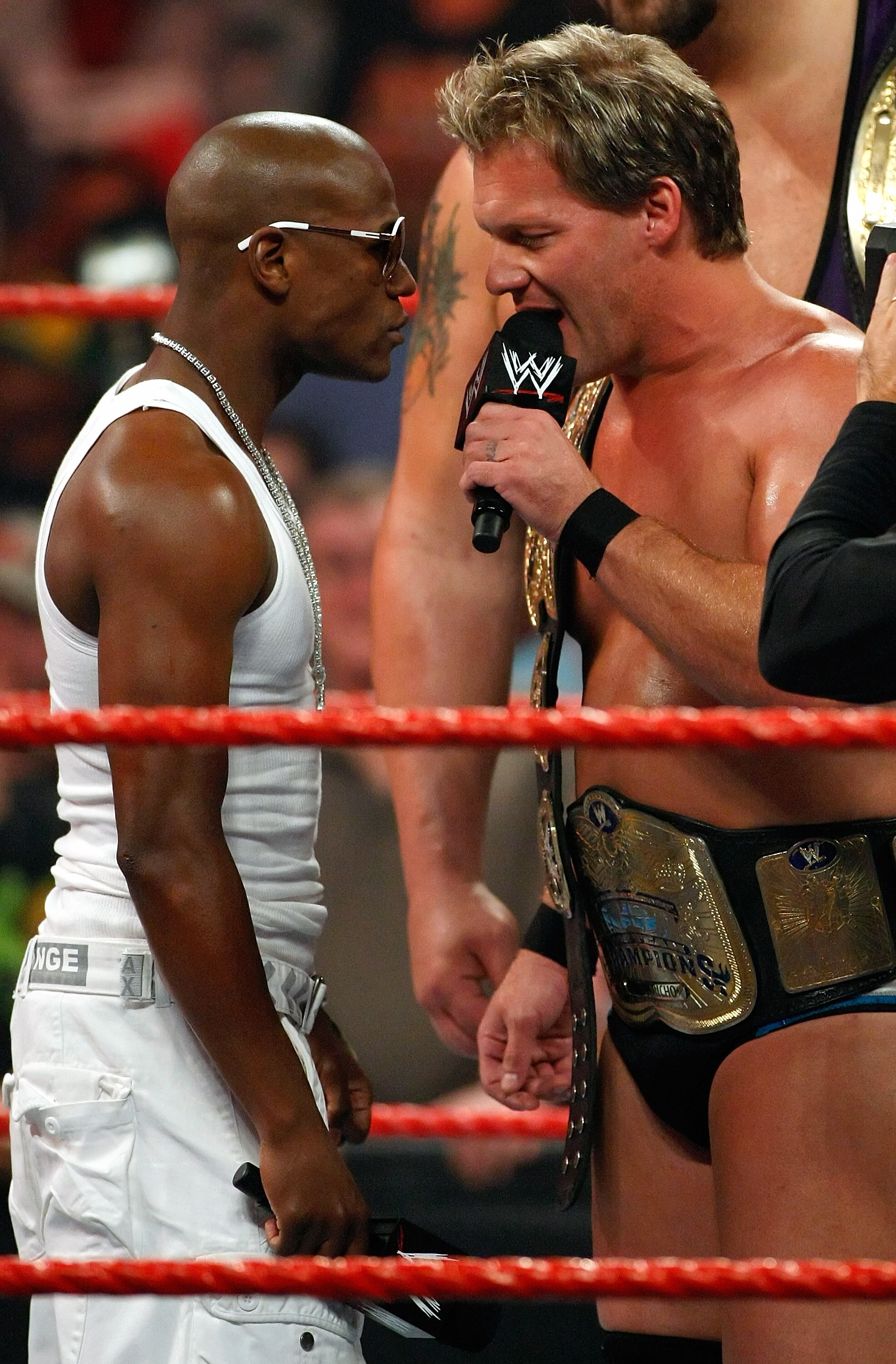 LAS VEGAS - AUGUST 24: Boxer Floyd Mayweather Jr. (L) stares down wrestler Chris Jericho during the WWE Monday Night Raw show at the Thomas & Mack Center August 24, 2009 in Las Vegas, Nevada. Mayweather was a special guest host during the broadcast. (Ph LAS VEGAS - AUGUST 24: Boxer Floyd Mayweather Jr. (L) stares down wrestler Chris Jericho during the WWE Monday Night Raw show at the Thomas & Mack Center August 24, 2009 in Las Vegas, Nevada. Mayweather was a special guest host during the broadcast. (Ph