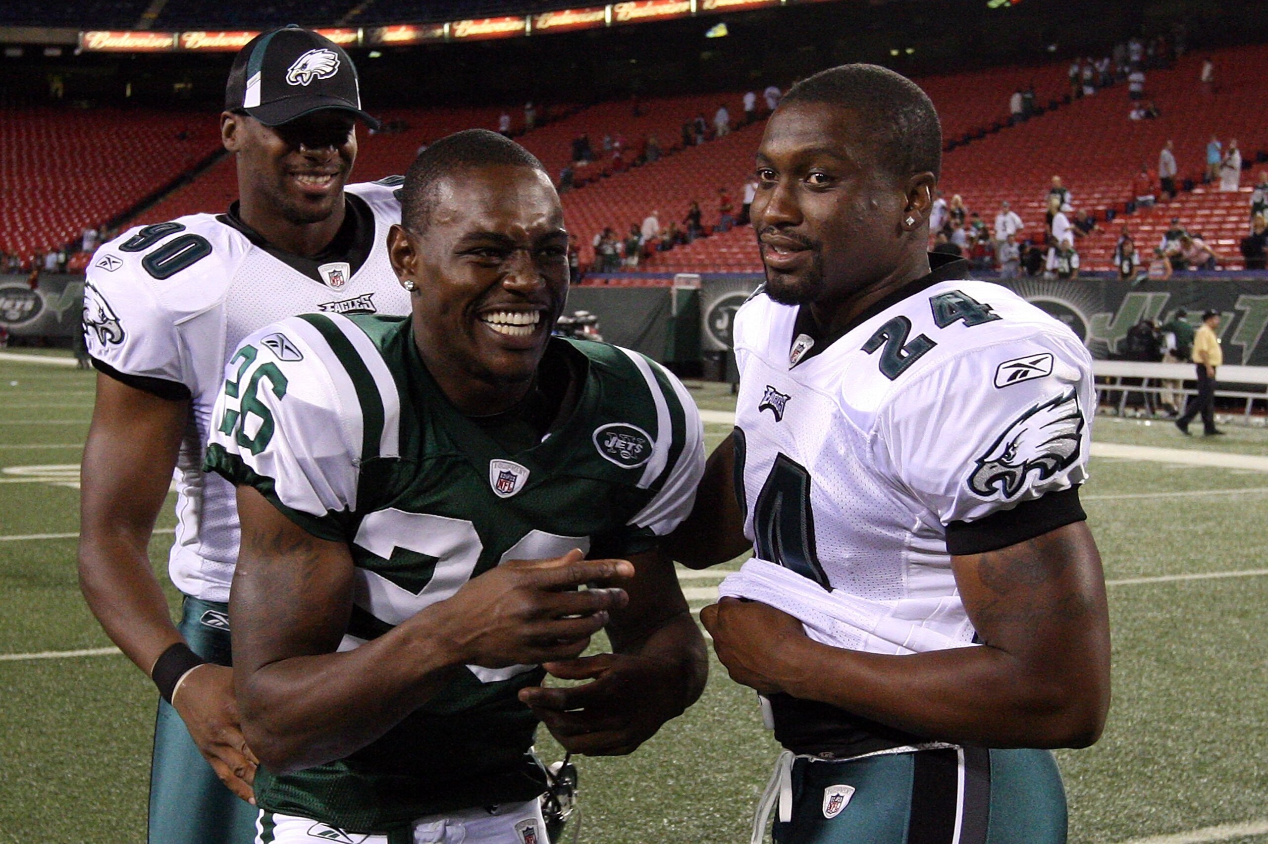 EAST RUTHERFORD, NJ - SEPTEMBER 03:  Lito Sheppard #26 of the New York Jets jokes with former teammates Sheldon Brown #24 and Darren Howard #90 of the Philadelphia Eagles after their game on September 3, 2009 at Giants Stadium in East Rutherford, New Jers