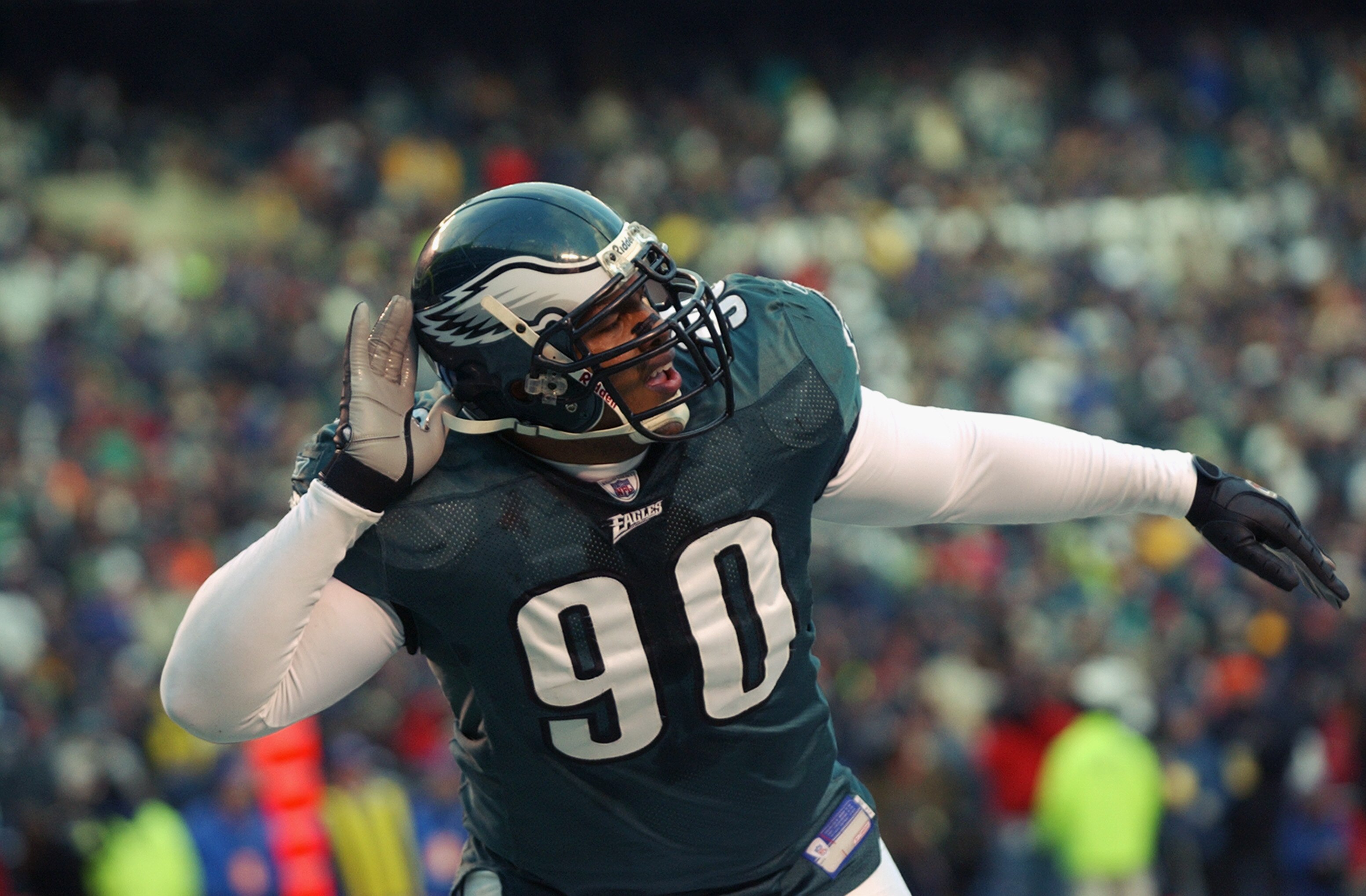 PHILADELPHIA - JANUARY 19:  Defensive tackle Corey Simon #90 of the Philadelphia Eagles celebrates after the Eagles score a field goal during the first half of the NFC Championship game against the Tampa Bay Buccaneers at Veterans Stadium on January 19, 2