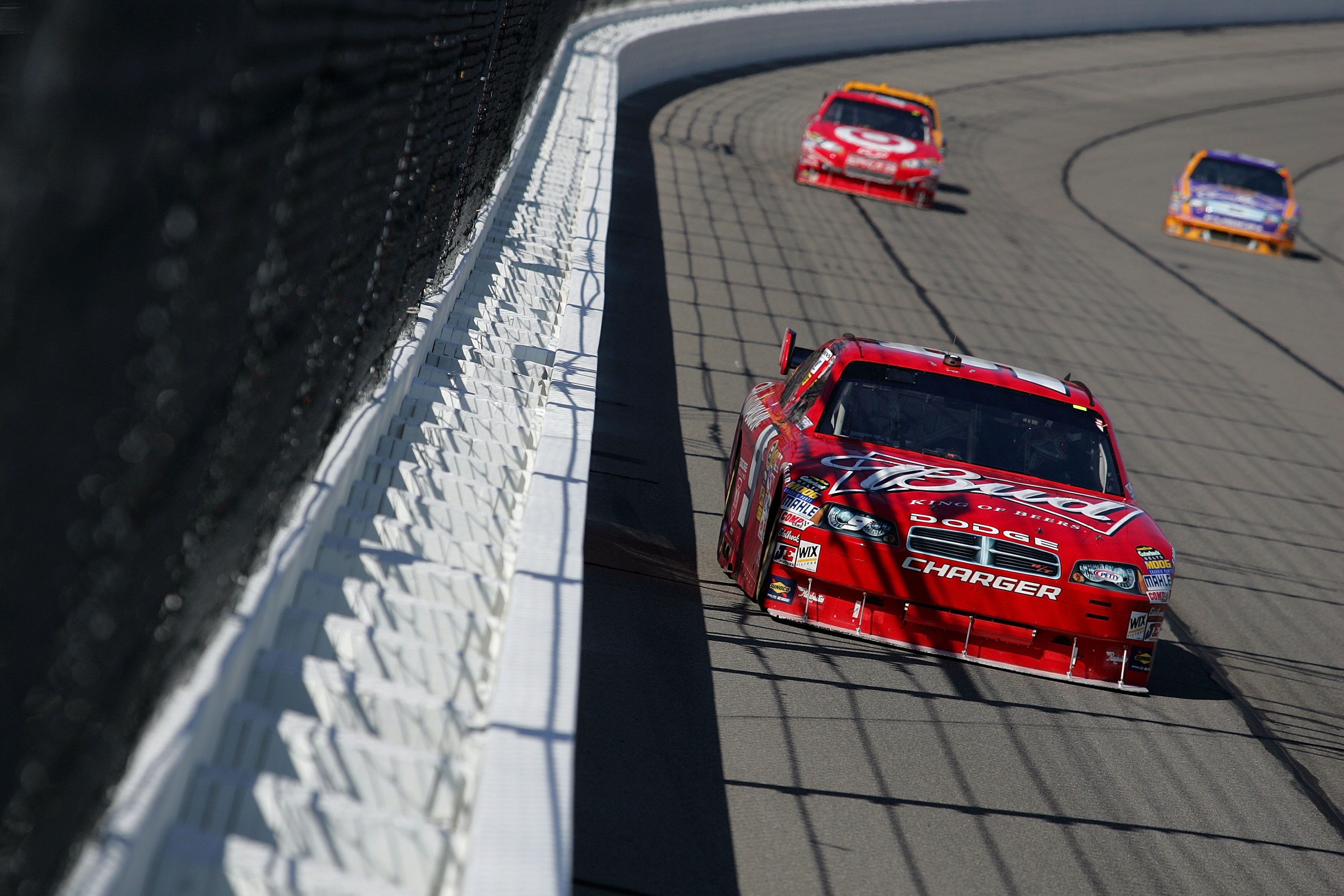 KANSAS CITY, KS - OCTOBER 04:  Kasey Kahne, driver of the #9 Budweiser Dodge, leads Juan Pablo Montoya, driver of the #42 Target Chevorlet during the NASCAR Sprint Cup Series Price Chopper 400 presented by Kraft Foods at the Kansas Speedway on October 4,