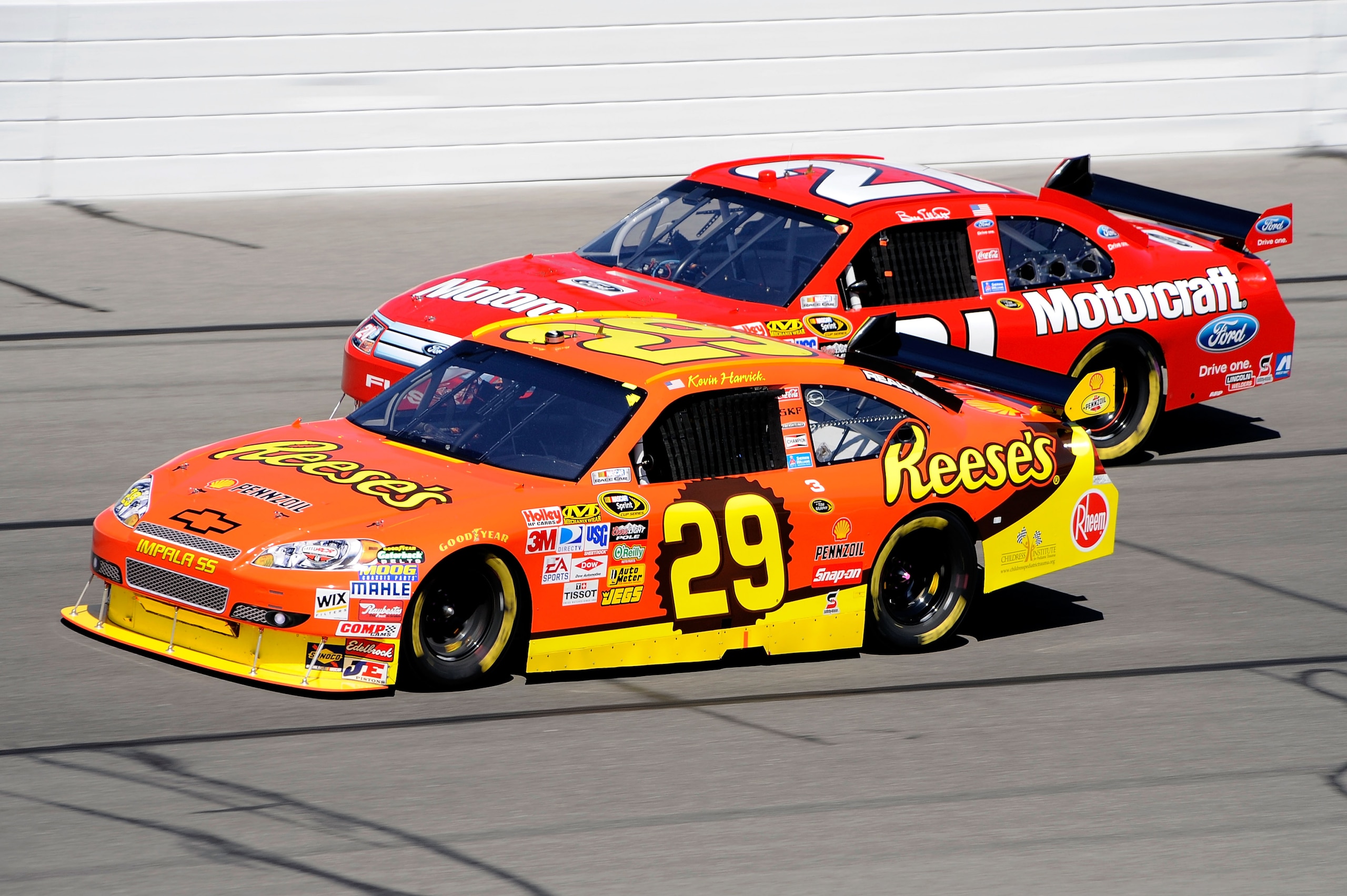 KANSAS CITY, KS - OCTOBER 04:  Kevin Harvick, driver of the #29 Reese's Chevrolet, leads Bill Elliott, driver of the #21 Motorcraft Ford, during the NASCAR Sprint Cup Series Price Chopper 400 presented by Kraft Foods at the Kansas Speedway on October 4, 2