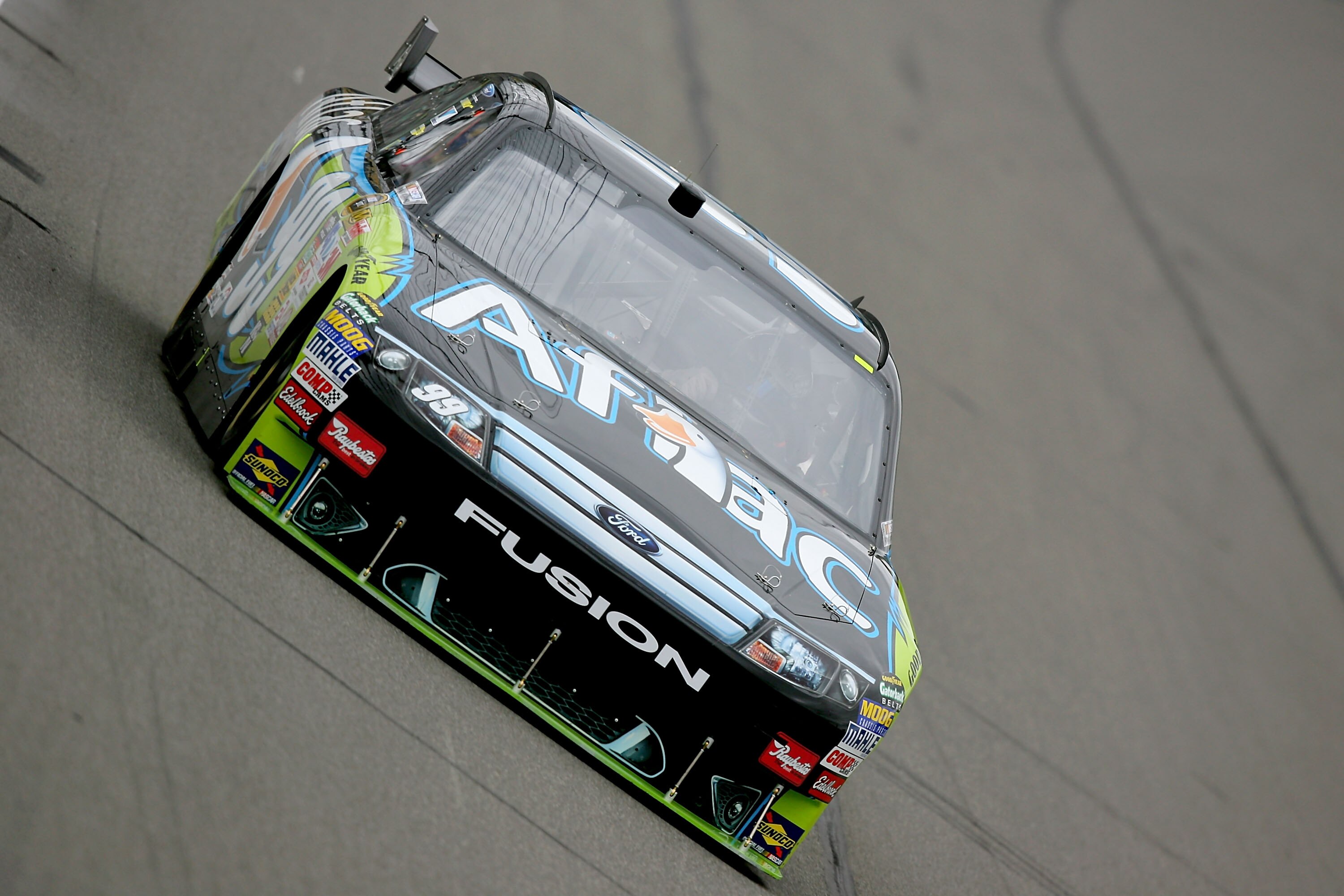 KANSAS CITY, KS - OCTOBER 03:  Carl Edwards, driver of the #99 Aflac Ford, drives during practice for the NASCAR Sprint Cup Series Price Chopper 400 presented by Kraft Foods at the Kansas Speedway on October 3, 2009 in Kansas City, Kansas.  (Photo by Matt