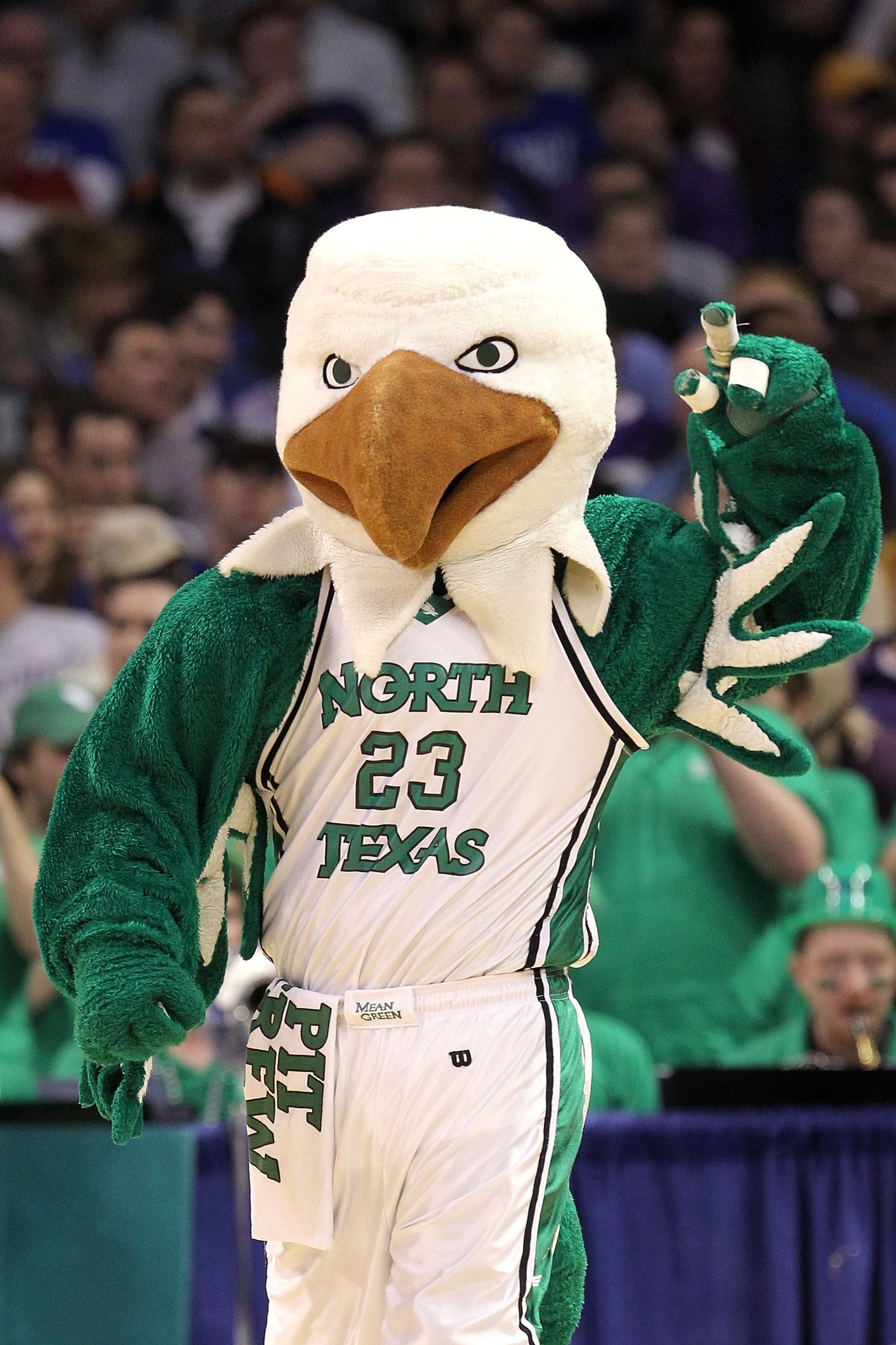 OKLAHOMA CITY - MARCH 18:  Scrappy the mascot for the North Texas Mean Green performs against the Kansas State Wildcats during the first round of the 2010 NCAA men's basketball tournament at Ford Center on March 18, 2010 in Oklahoma City, Oklahoma.  (Phot