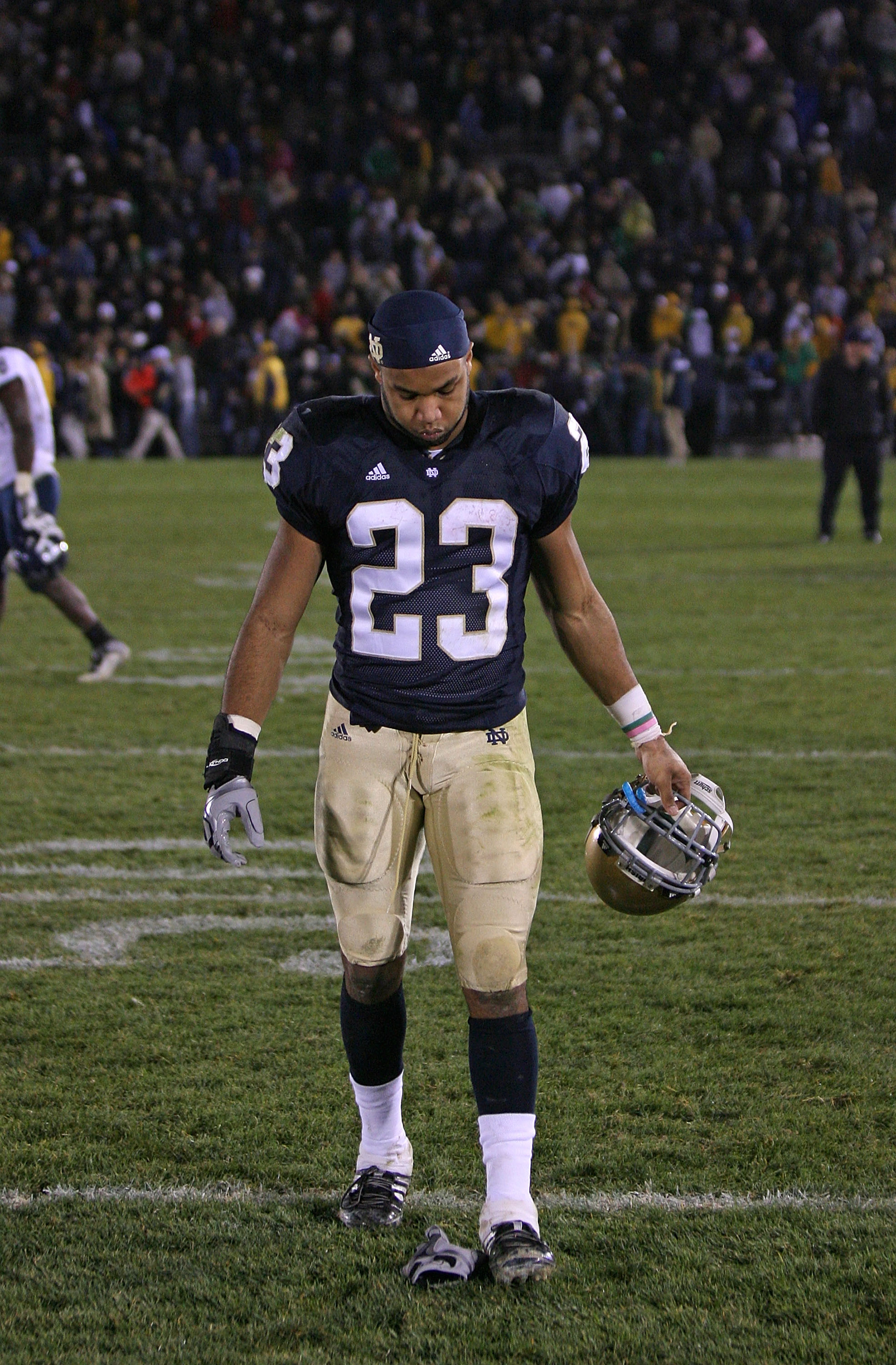 SOUTH BEND, IN - NOVEMBER 21: Golden Tate #23 of the Notre Dame Fighting Irish walks off the field after a loss to the Univeristy of Connecticut Huskies at Notre Dame Stadium on November 21, 2009 in South Bend, Indiana. Connecticut defeated Notre Dame 33-