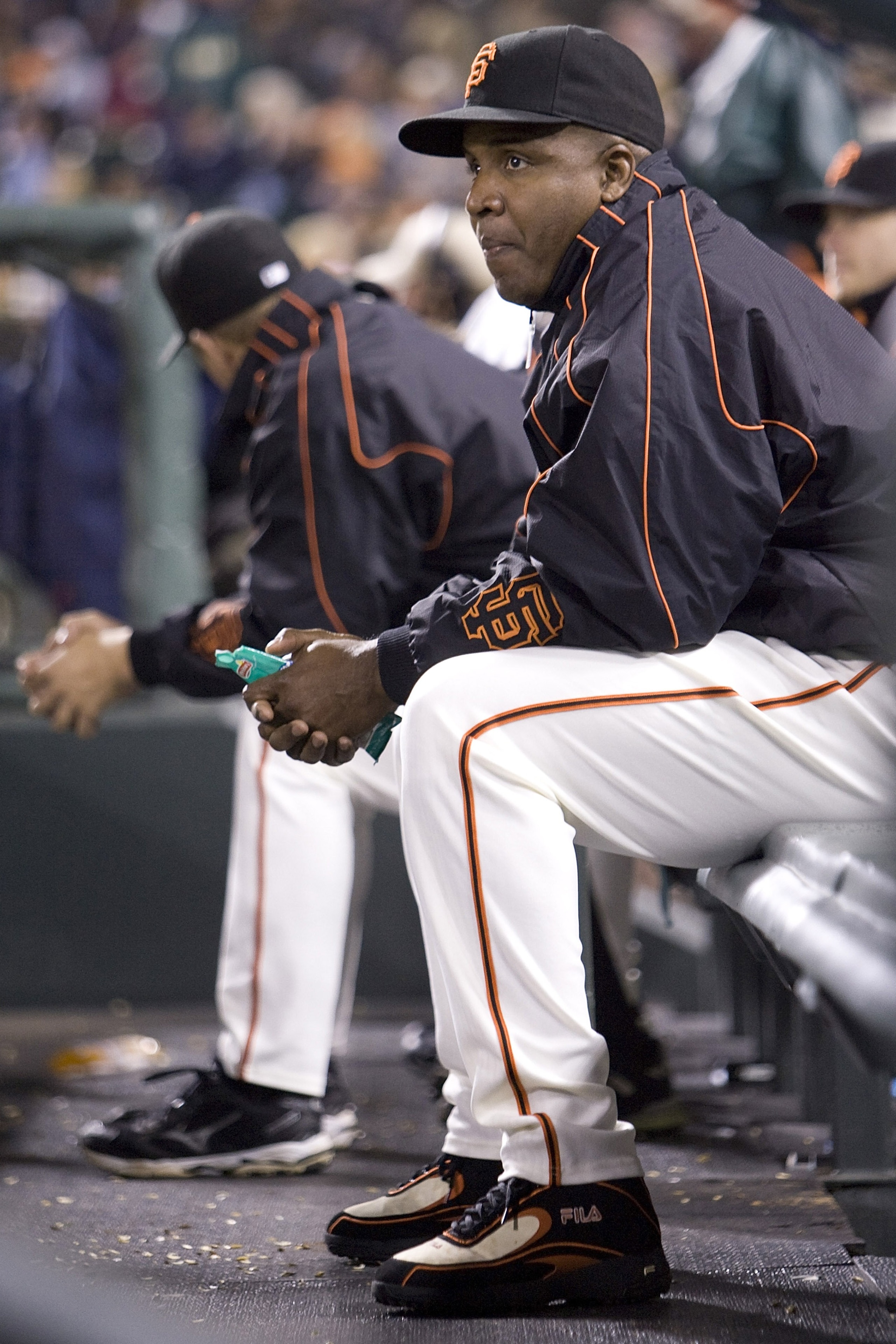 SAN FRANCISCO - SEPTEMBER 21:  San Francisco Giants left fielder Barry Bonds watches the game from the Giants dugout after a press conference earlier in the day announcing the Giants will not bring Barry Bonds back for the Giants 2008 season September 21,