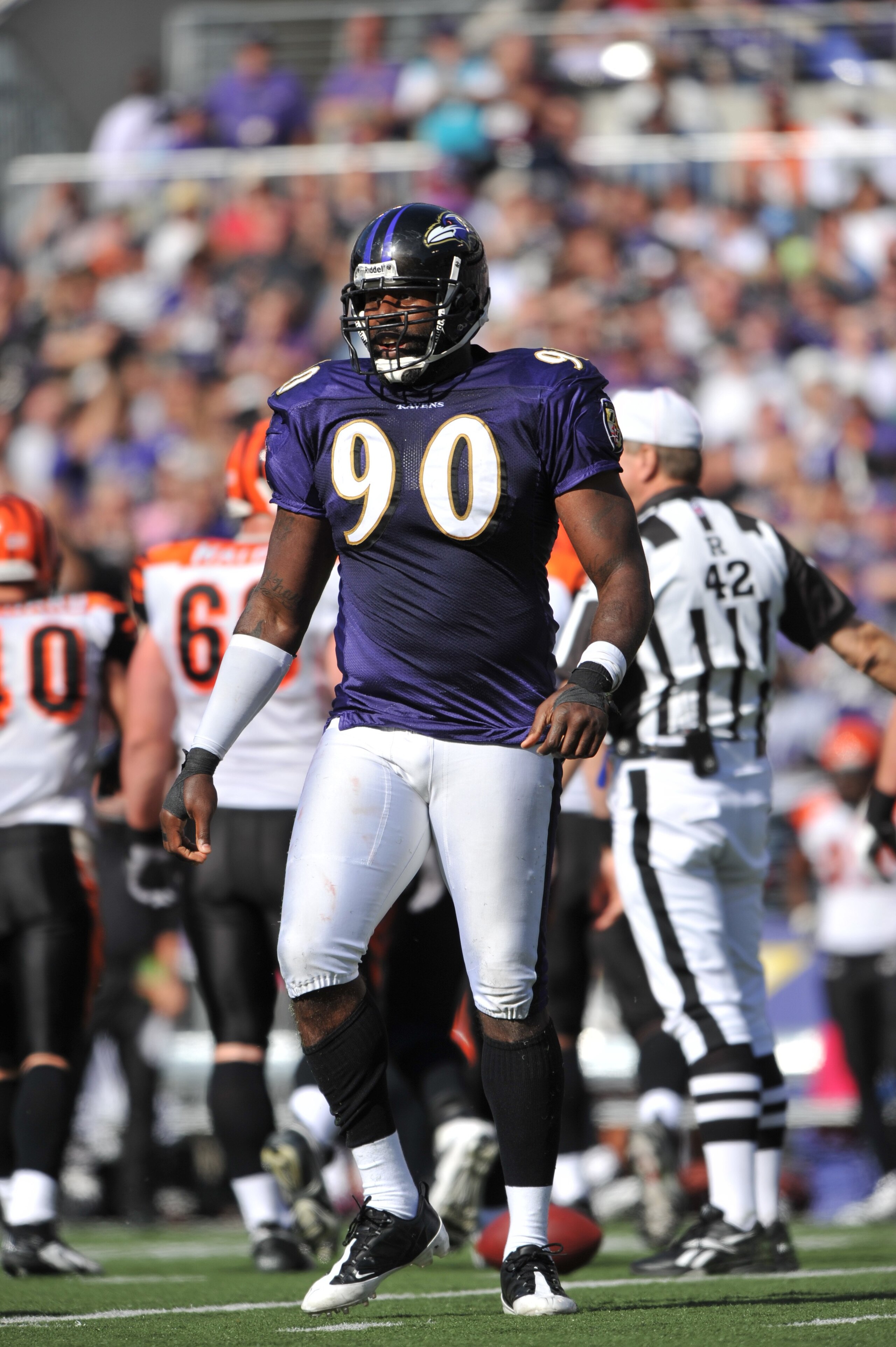 BALTIMORE - OCTOBER 11: Trevor Pryce #90 of the Baltimore Ravens returns to the huddle during the game against the Cincinnati Bengals at M&T Bank Stadium on October 11, 2009 in Baltimore, Maryland. The Bengals defeated the Ravens 17-14. (Photo by Larry F BALTIMORE - OCTOBER 11: Trevor Pryce #90 of the Baltimore Ravens returns to the huddle during the game against the Cincinnati Bengals at M&T Bank Stadium on October 11, 2009 in Baltimore, Maryland. The Bengals defeated the Ravens 17-14. (Photo by Larry F