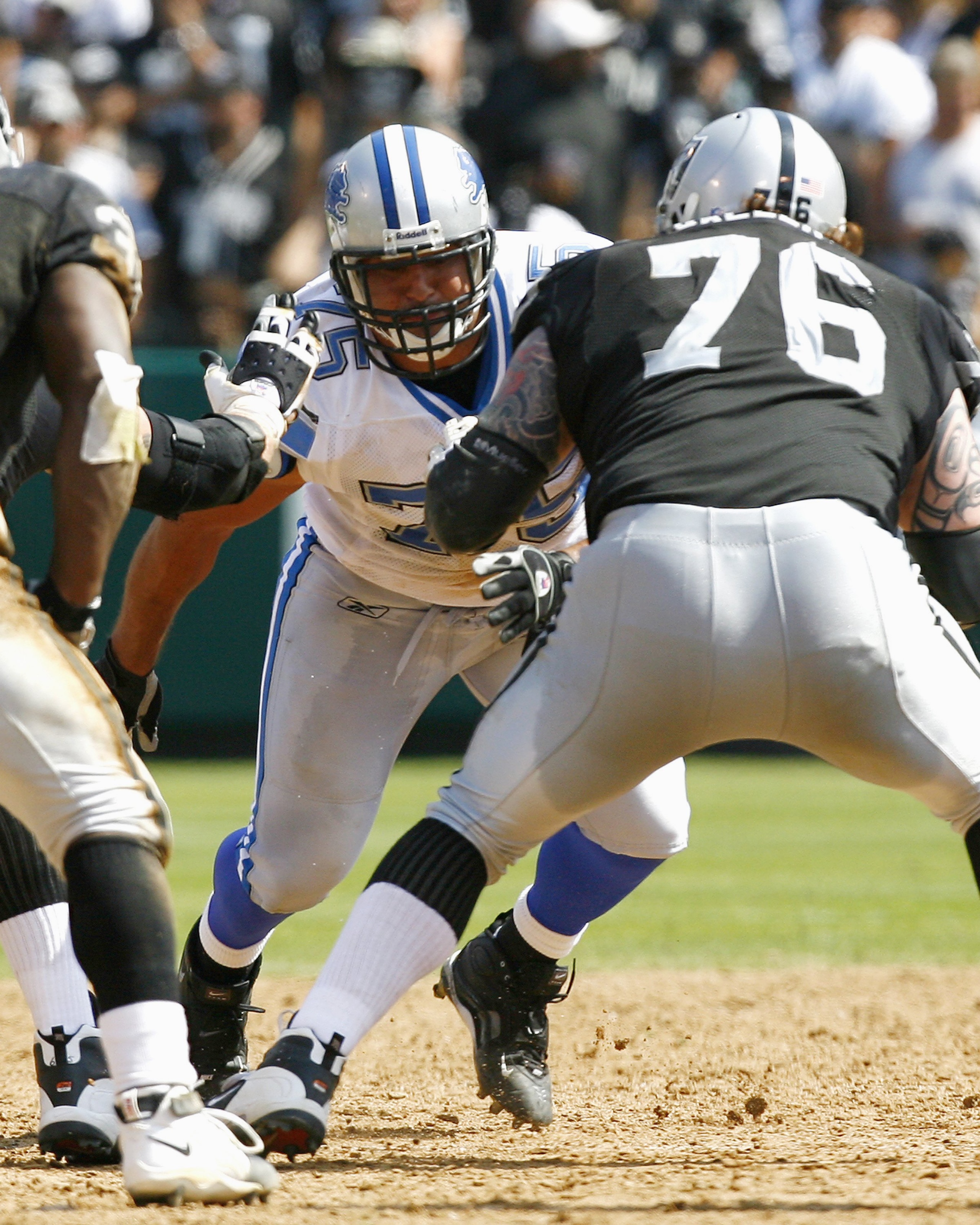 OAKLAND, CA - SEPTEMBER 9:  Defensive tackle Shaun Cody #75 of the Detroit Lions fires off the line to take on   guard Robert Gallery of the Oakland Raiders at the McAfee Coliseum on September 9, 2007 in Oakland, California.  The Lions defeated the Raider