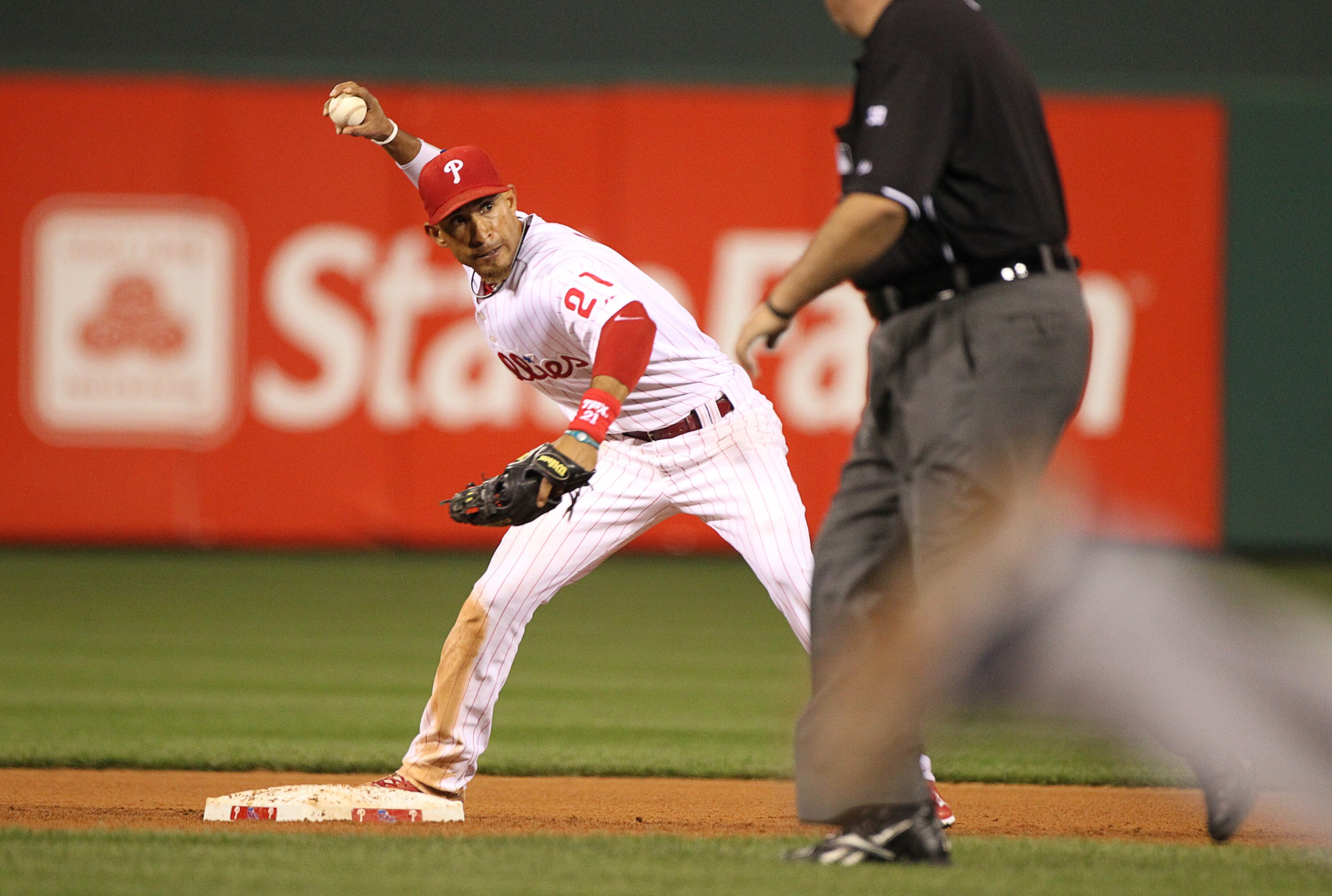 PHILADELPHIA - SEPTEMBER 25: Shortstop Wilson Valdez #21 of the Philadelphia Phillies throws to first base during a game against the New York Mets at Citizens Bank Park on September 25, 2010 in Philadelphia, Pennsylvania. The Mets won 5-2. (Photo by Hunte