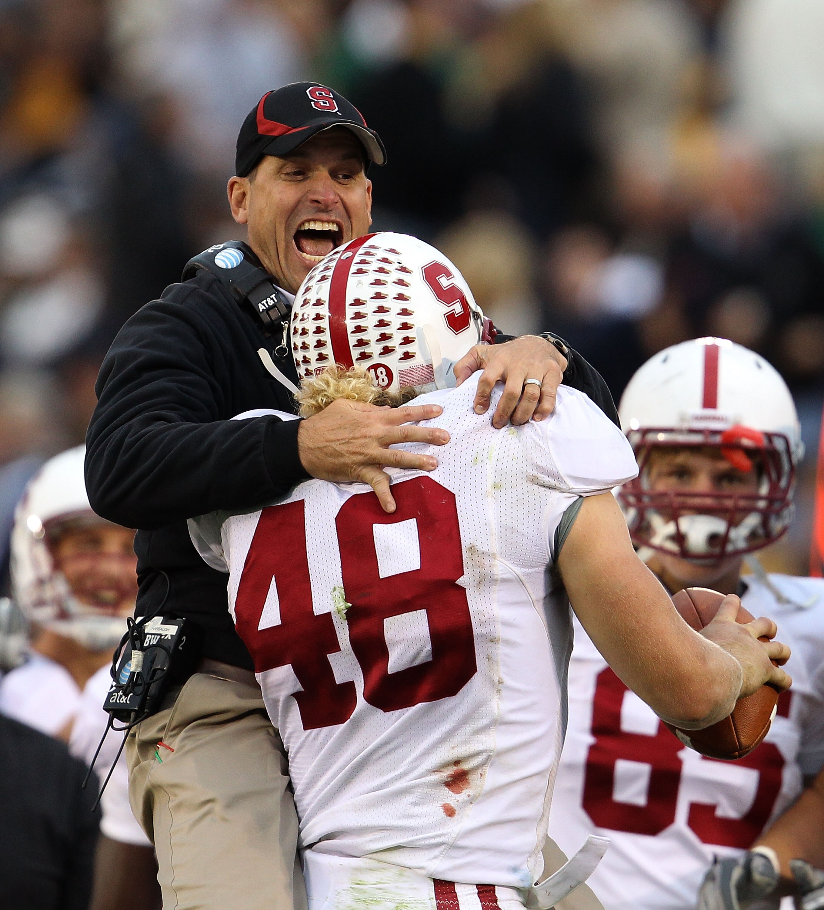 SOUTH BEND, IN - SEPTEMBER 25: Head coach Jim Harbaugh of the Stanford Cardinal jumps to greet Owen Marecic #48 after Marecic intercepted a pass for a touchdown against the Notre Dame Fighting Irish at Notre Dame Stadium on September 25, 2010 in South Ben