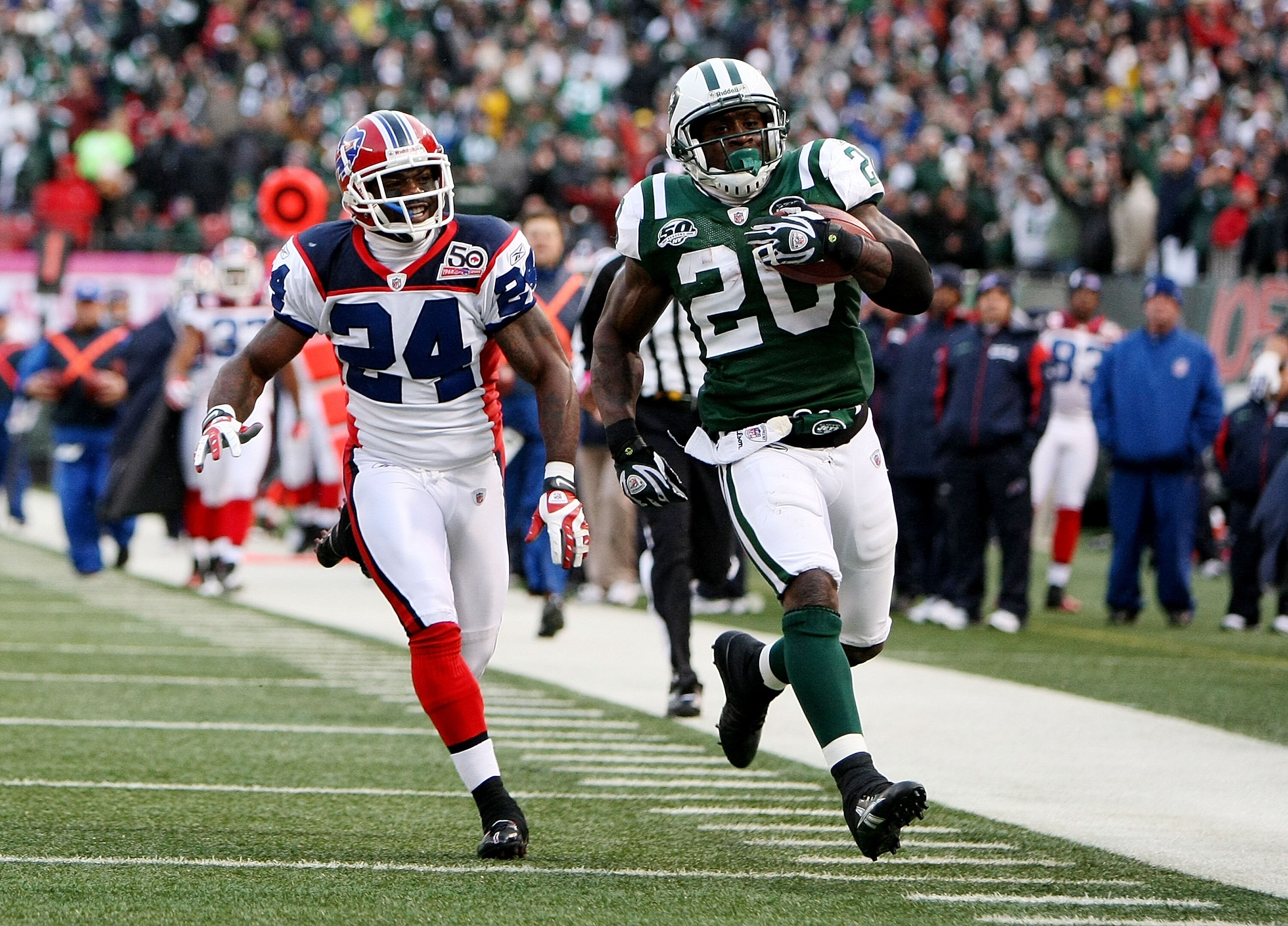 EAST RUtheRFORD, NJ - OCTOBER 18:  Thomas Jones #20 of the New York Jets scores a touchdown as Terrence McGee #24 of the Buffalo Bills defends during their game on October 18, 2009 at Giants Stadium in East Rutherford, New Jersey.  (Photo by Al Bello/Gett