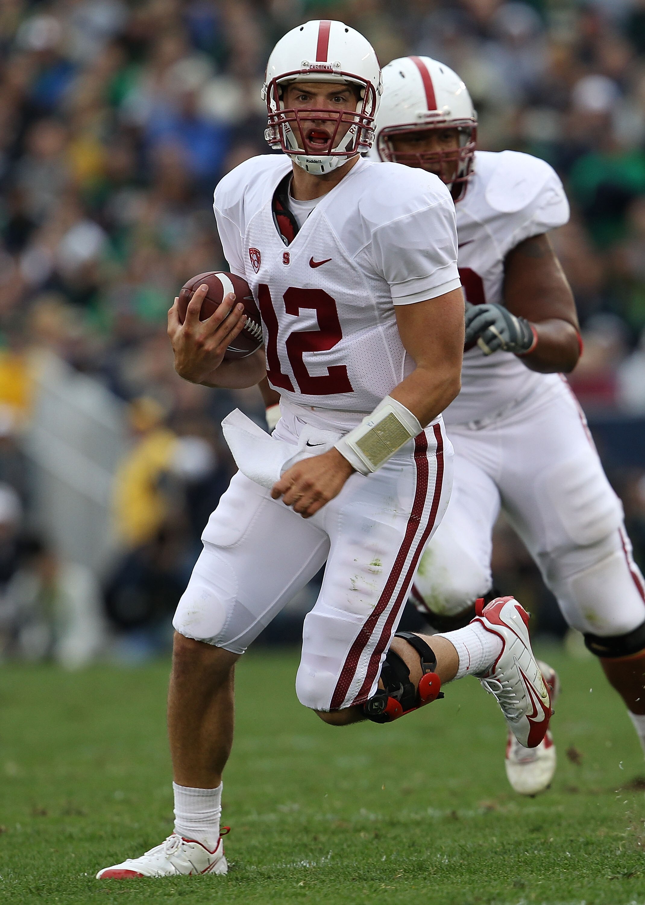 SOUTH BEND, IN - SEPTEMBER 25: Andrew Luck #12 of the Stanford Cardinal runs for yardage against the Notre Dame Fighting Irish at Notre Dame Stadium on September 25, 2010 in South Bend, Indiana. Stanford defeated Notre Dame 37-14. (Photo by Jonathan Danie