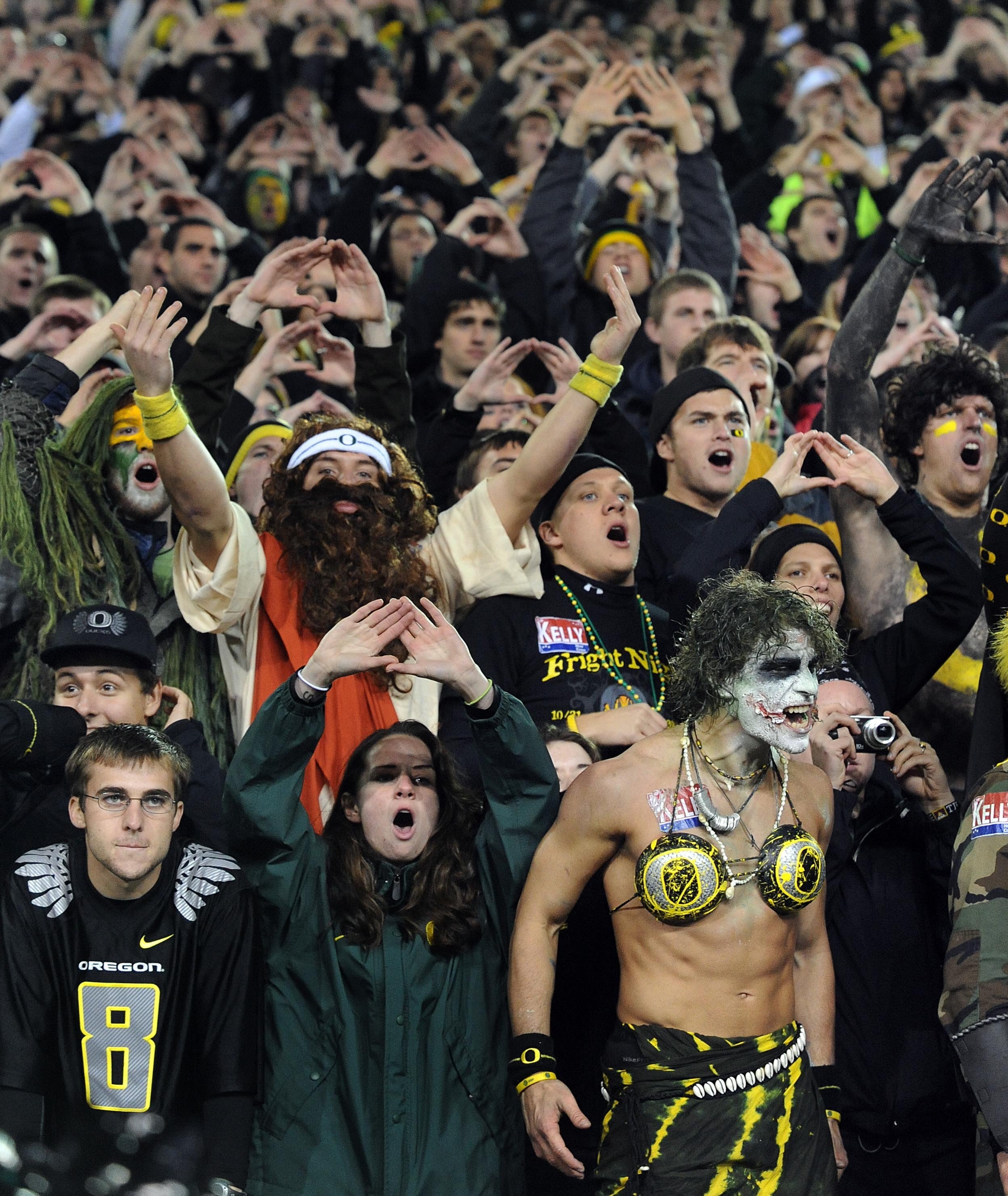 EUGENE, OR - OCTOBER 31:  Oregon Ducks fans make some noise on a Halloween night game against the USC Trojans at Autzen Stadium on October 31, 2009 in Eugene, Oregon. The crowd noise at Autzen Stadium is said to be one of the loudest in the nation and rep