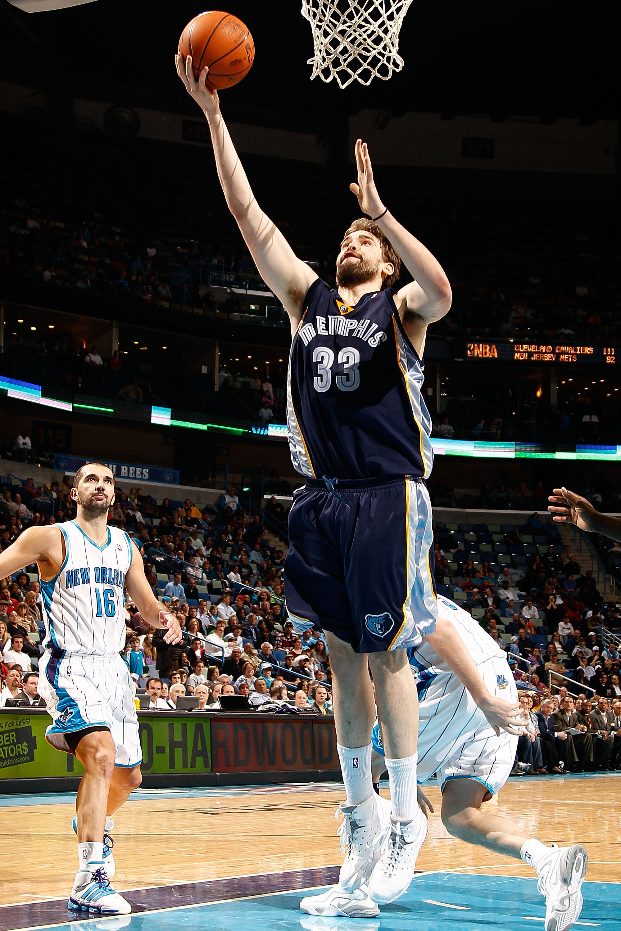NEW ORLEANS - MARCH 03:  Marc Gasol #33of the Memphis Grizzlies shoots the ball around Peja Stojakovic #16 of the New Orleans Hornets at the New Orleans Arena on March 3, 2010 in New Orleans, Louisiana.  The Grizzlies defeated the Hornets 104-100.  NOTE T