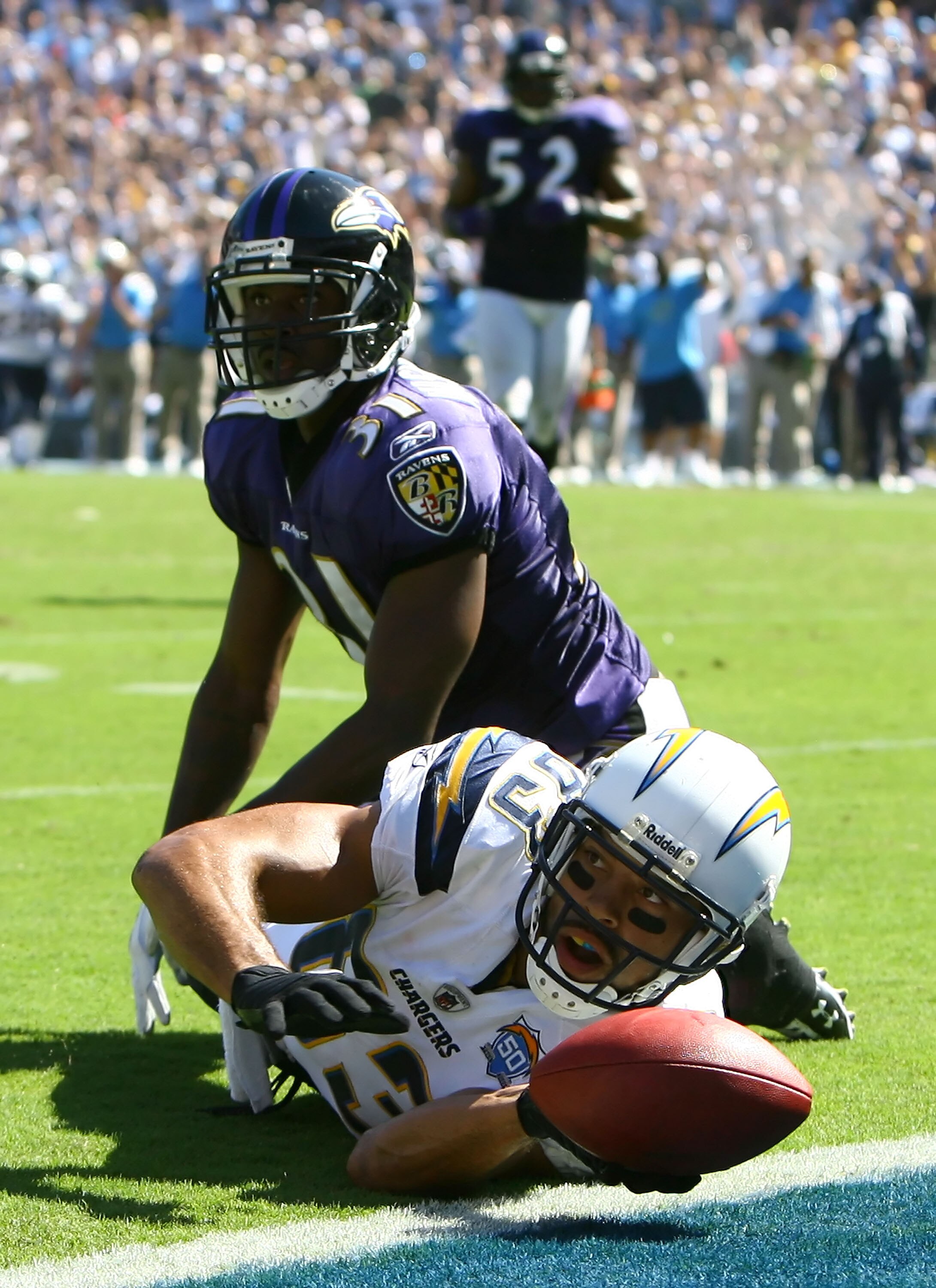 SAN DIEGO , CA - SEPTEMBER 20:  Wide receiver Vincent Jackson #83 of the San Diego Chargers and Fabian Washington #31 of the Baltimore Ravens look towards the official in the end zone (not pictured) for an indication of a touchdown in the third quarter at