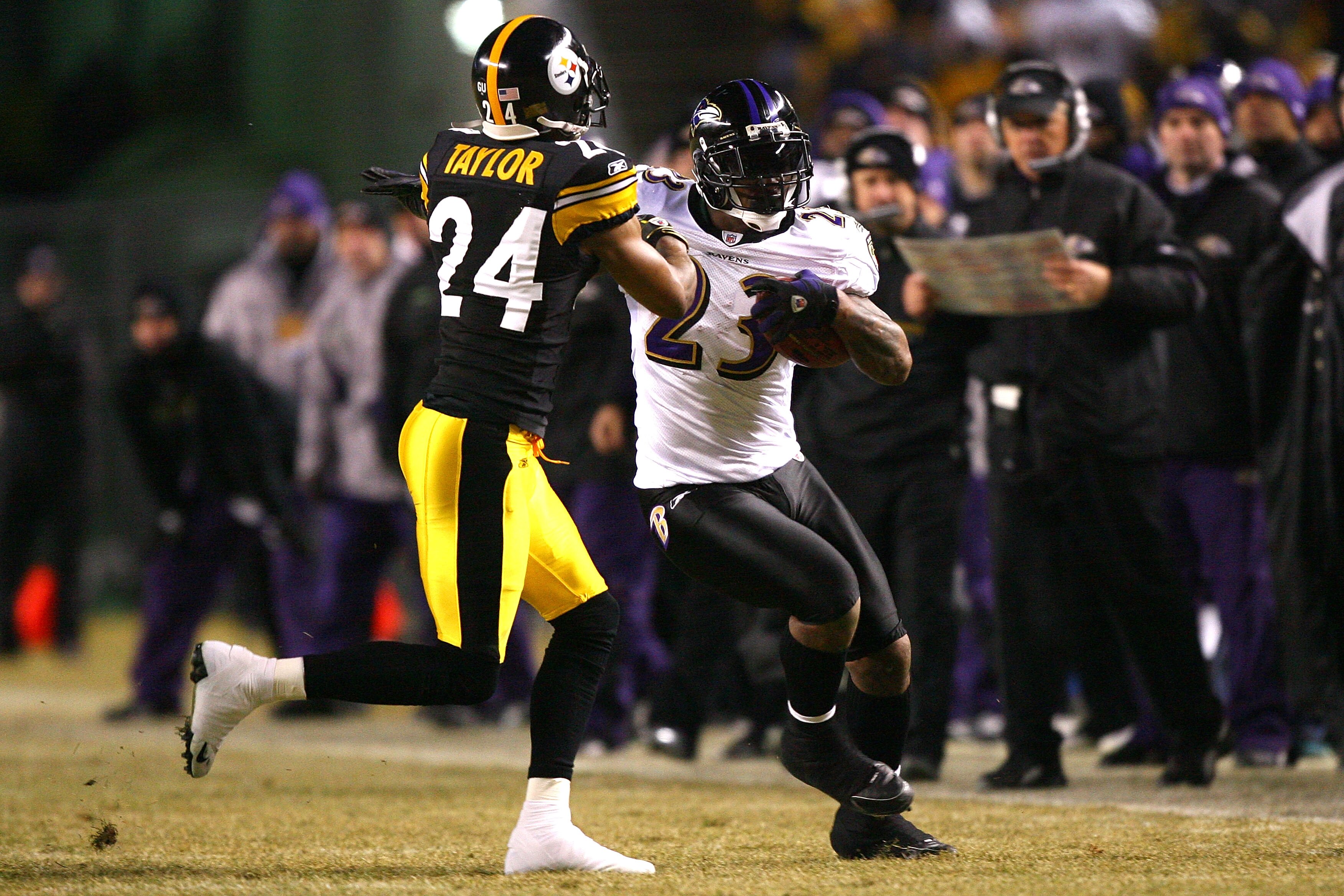 PITTSBURGH - JANUARY 18:  Willis McGahee #23 of the Baltimore Ravens runs the ball against Ike Taylor #24 of the Pittsburgh Steelers during the AFC Championship game on January 18, 2009 at Heinz Field in Pittsburgh, Pennsylvania.  (Photo by Al Bello/Getty